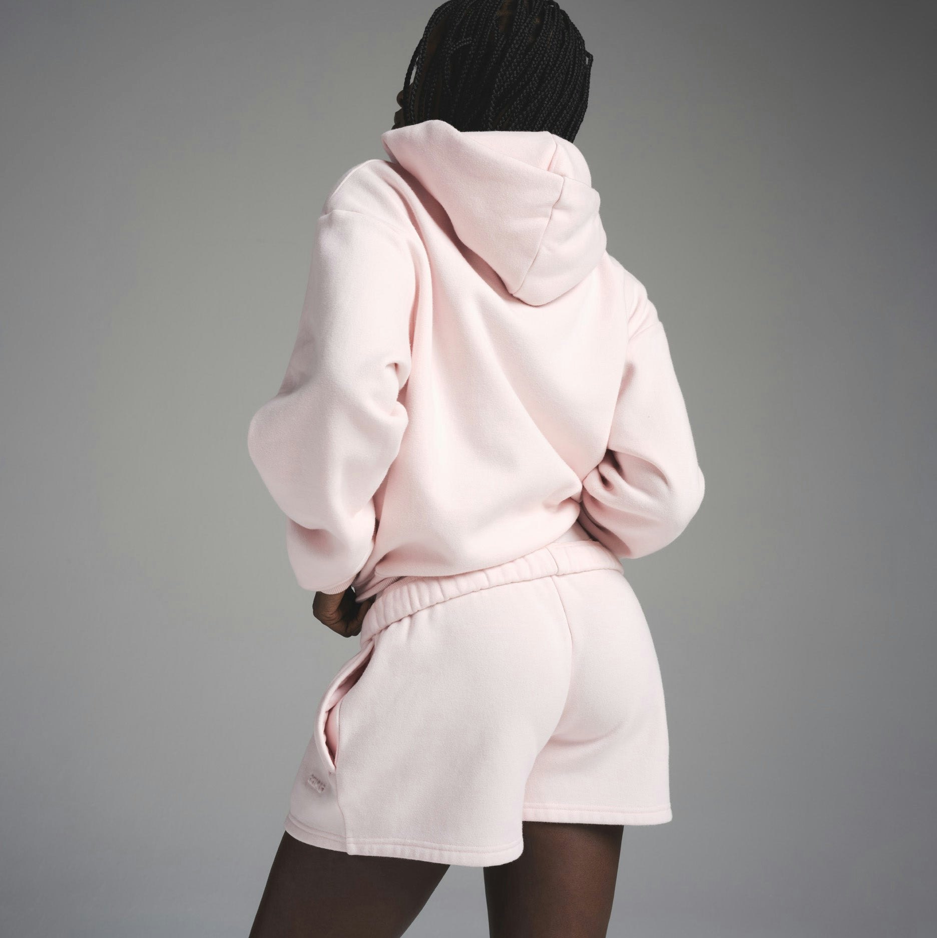 COTTON FLEECE CLASSIC SHORT | BARELY PINK ON A MODEL FRONT VIEW | FOCUS: 0.0, 1.0, 0.9