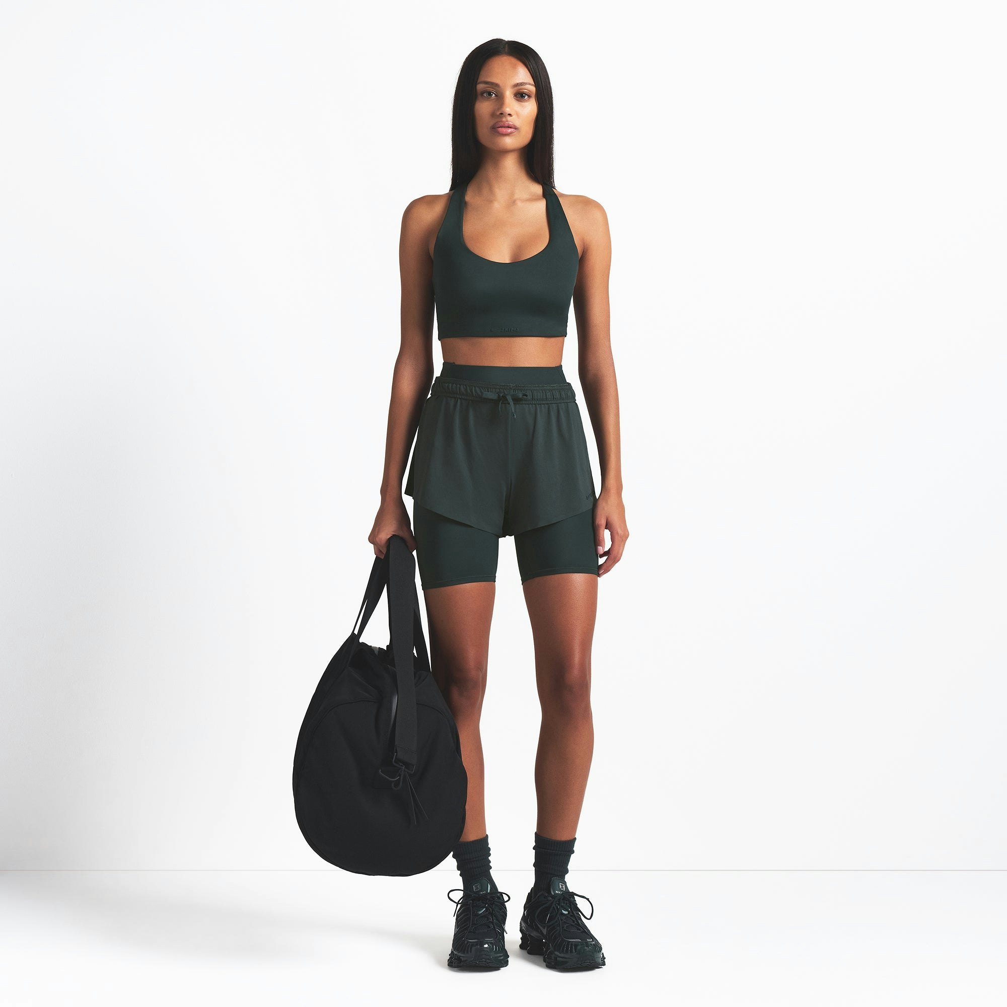 NikeSKIMS AIRY MINI SHORT | DARK TEAL ON A MODEL FRONT VIEW @ | FOCUS: 0.0, 1.0, 0.9