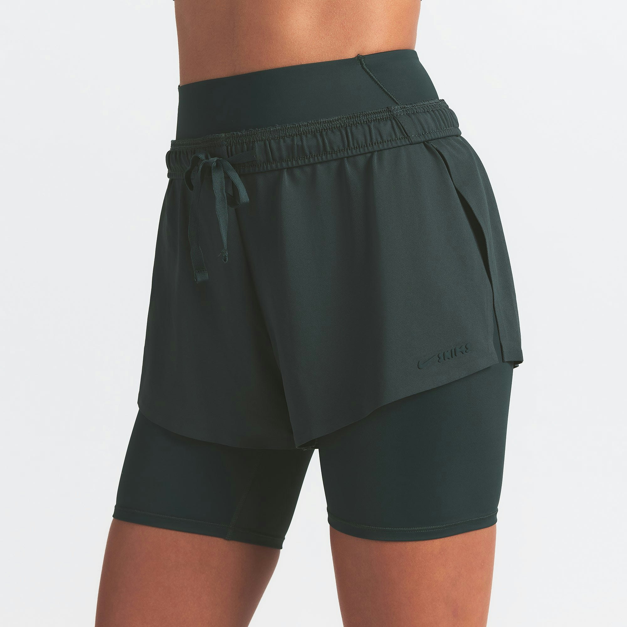 NikeSKIMS AIRY MINI SHORT | DARK TEAL ON A MODEL SIDE VIEW @ | FOCUS: 0.0, 1.0, 0.9