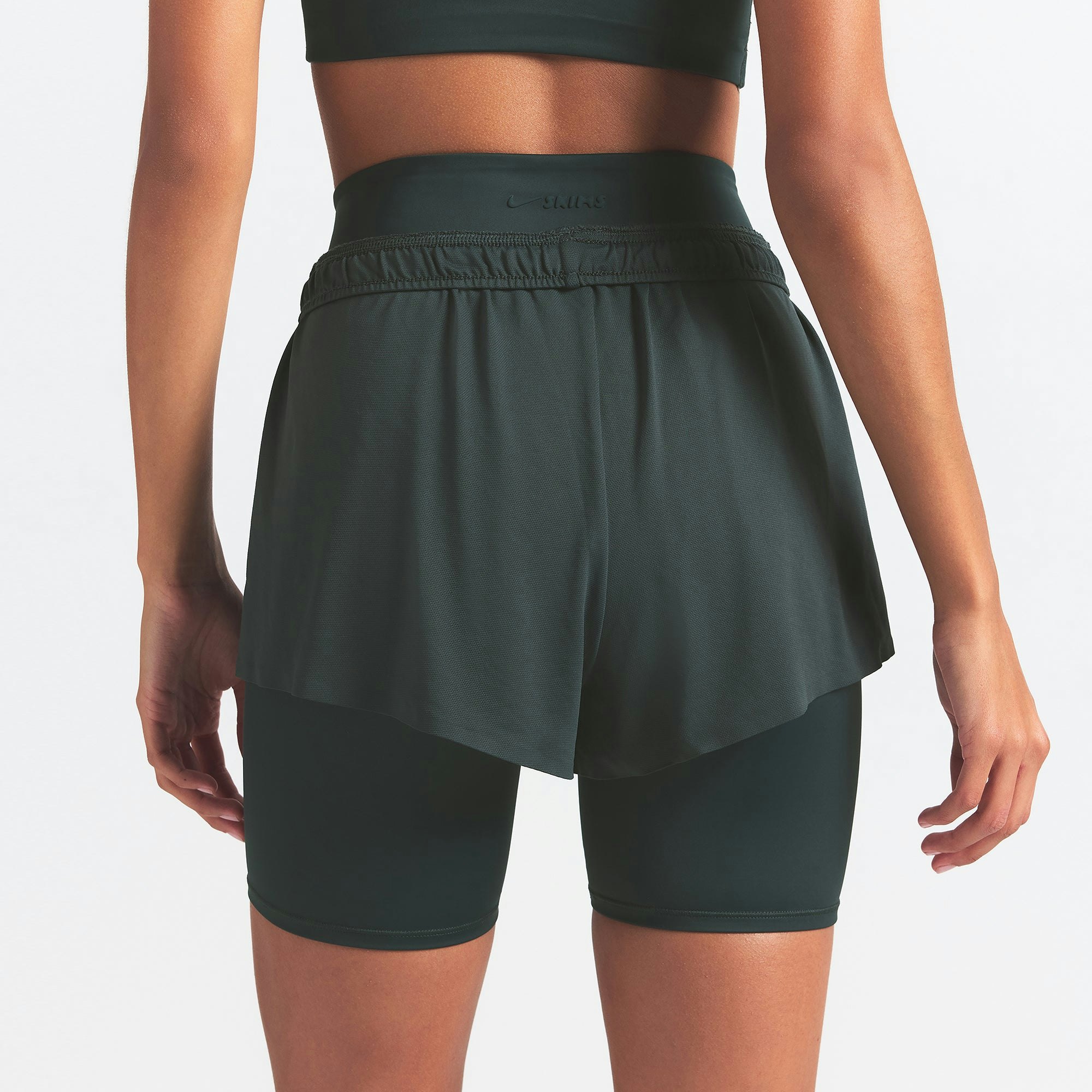 NikeSKIMS AIRY MINI SHORT | DARK TEAL ON A MODEL SIDE VIEW @ | FOCUS: 0.0, 1.0, 0.9