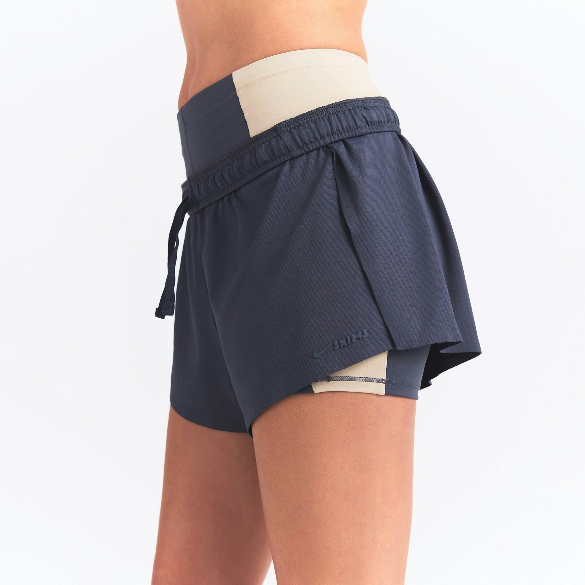 NikeSKIMS AIRY MINI SHORT | DEEP ROYAL ON A MODEL SIDE VIEW @ | FOCUS: 0.0, 1.0, 0.9