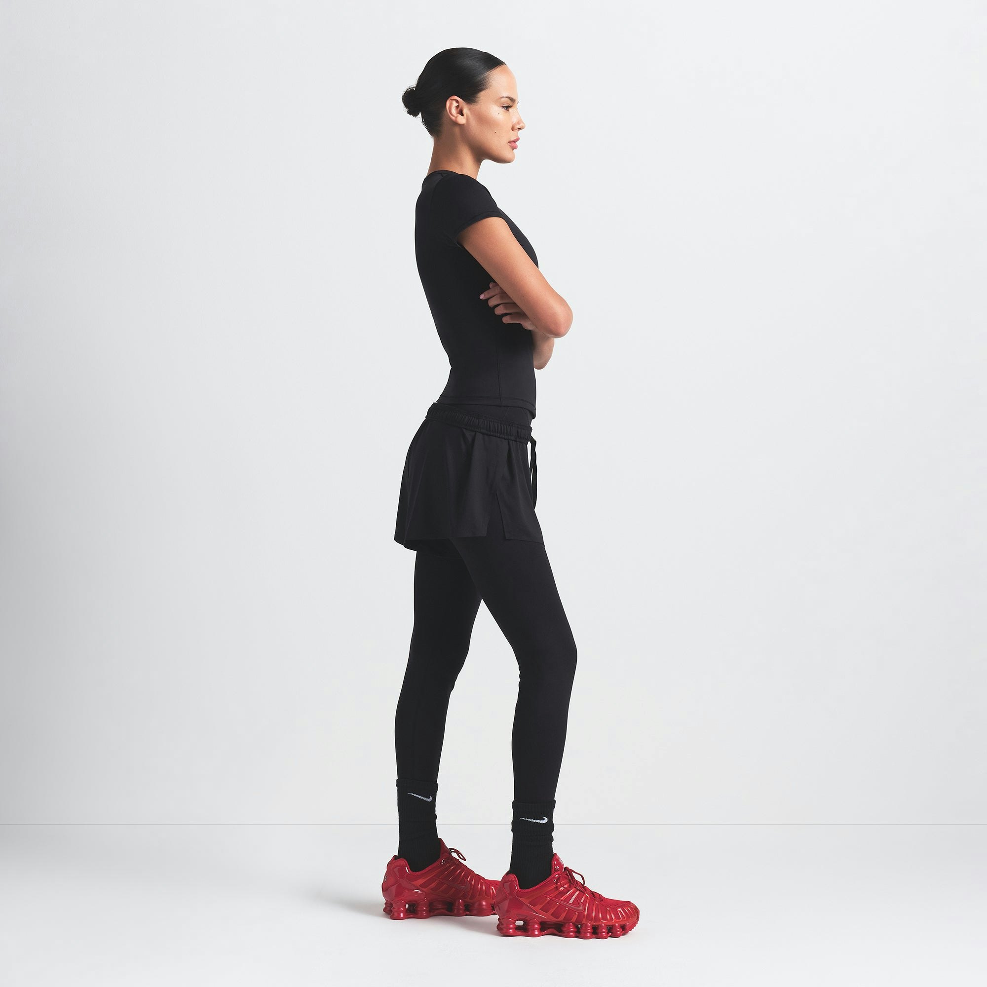 NikeSKIMS AIRY MINI SHORT | OBSIDIAN ON A MODEL SIDE VIEW @ | FOCUS: 0.9, 0.1, 0.7