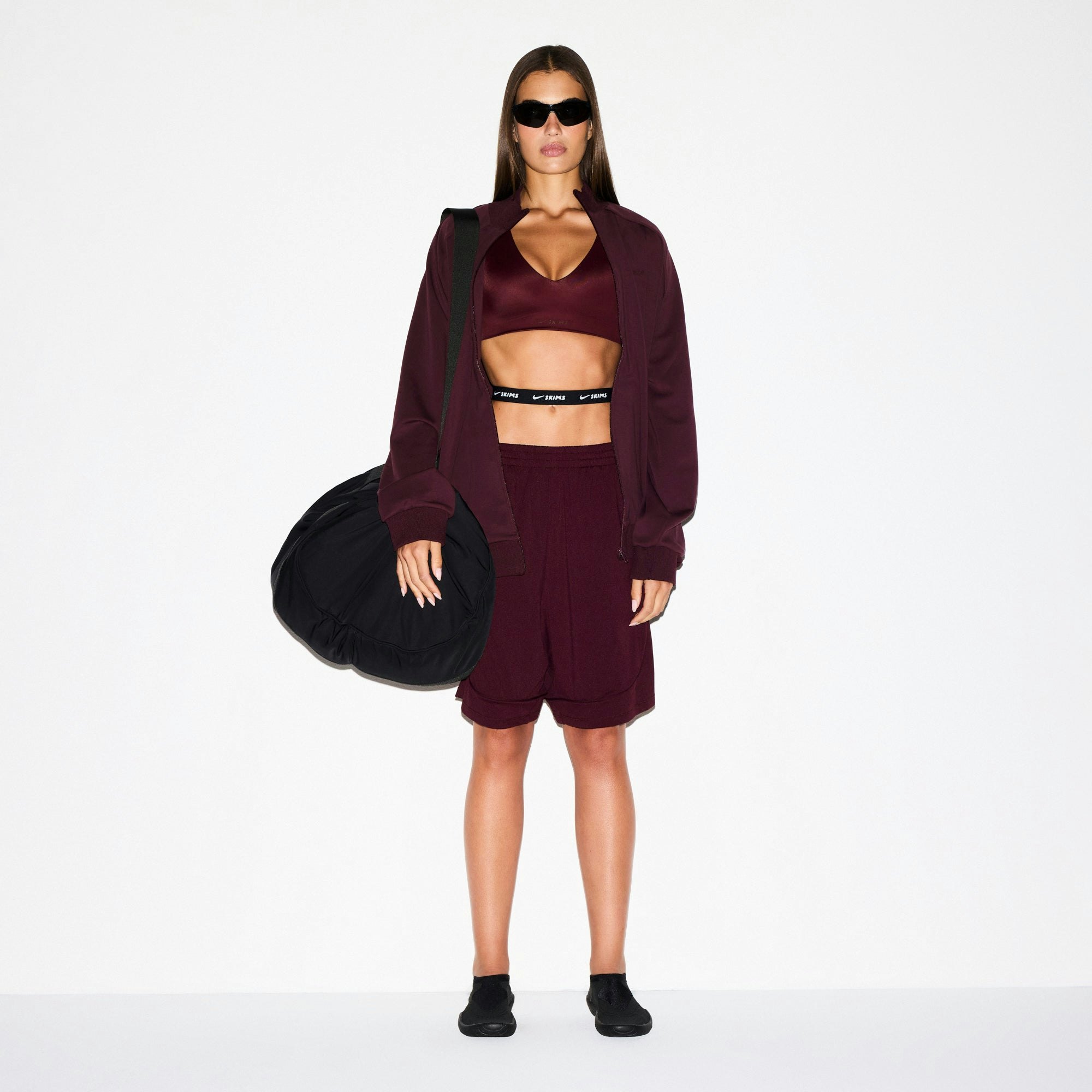 NikeSKIMS AIRY RELAXED SHORT | CURRANT ON A MODEL FRONT VIEW @ | FOCUS: 0.0, 1.0, 0.9