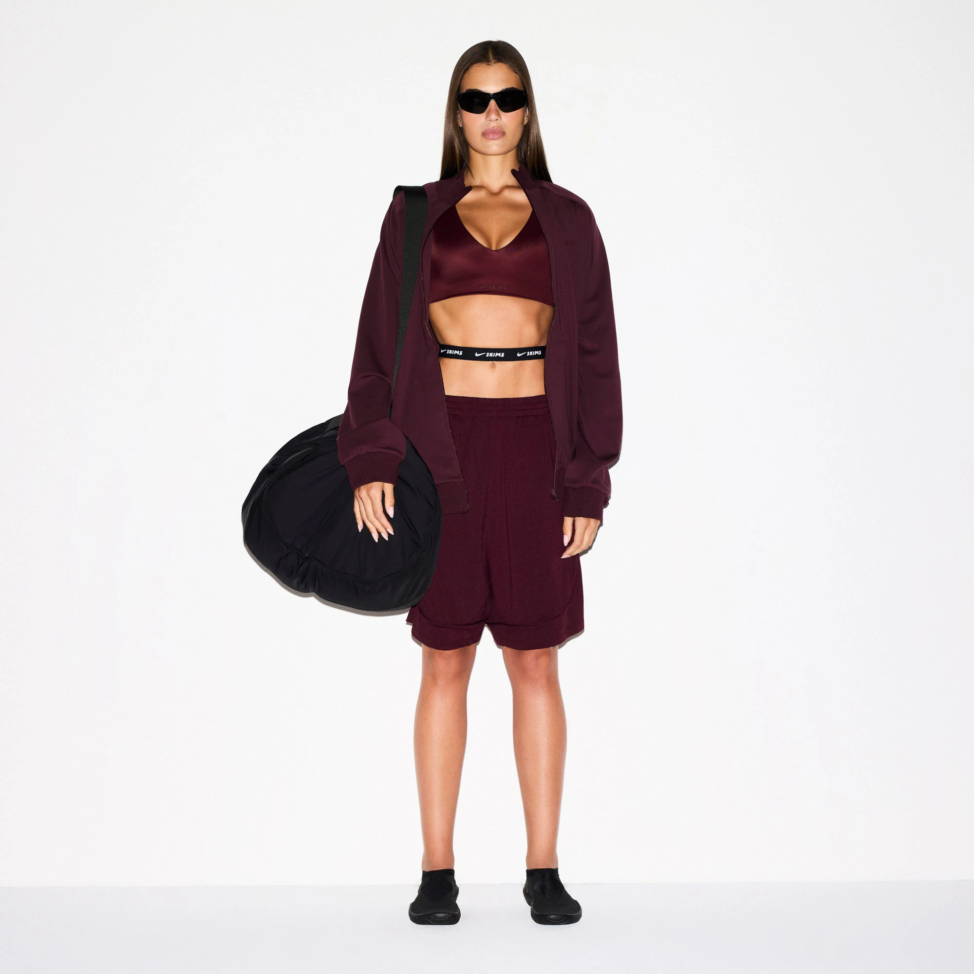 NikeSKIMS AIRY RELAXED SHORT | CURRANT ON A MODEL FRONT VIEW @ | FOCUS: 0.0, 1.0, 0.9