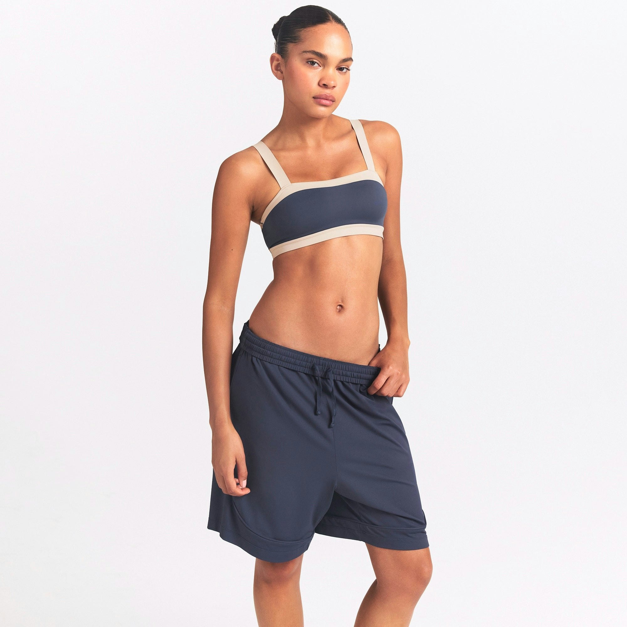 NikeSKIMS AIRY RELAXED SHORT | DEEP ROYAL ON A MODEL SIDE VIEW @ | FOCUS: 0.0, 1.0, 0.9