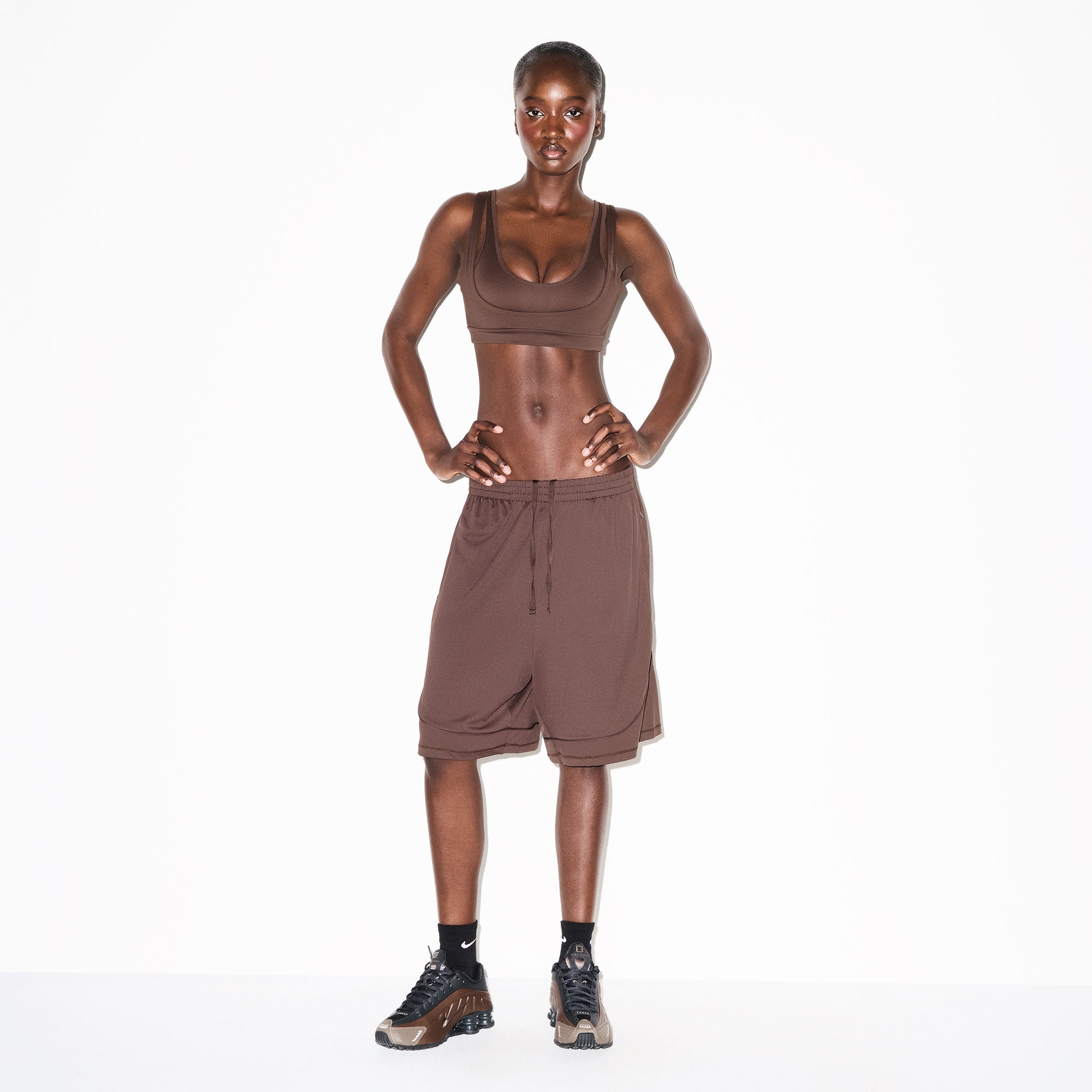 NikeSKIMS AIRY RELAXED SHORT | DARK SEPIA ON A MODEL FRONT VIEW @ | FOCUS: 0.0, 1.0, 0.9