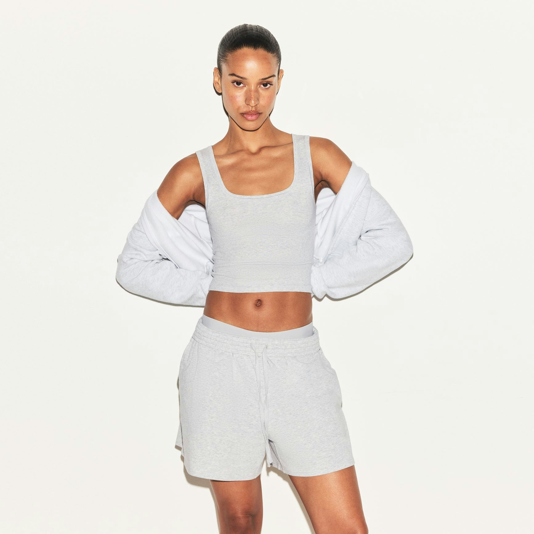 COTTON JERSEY CLASSIC SHORT | LIGHT HEATHER GREY ON A MODEL SIDE VIEW | FOCUS: 0.0, 1.0, 0.9