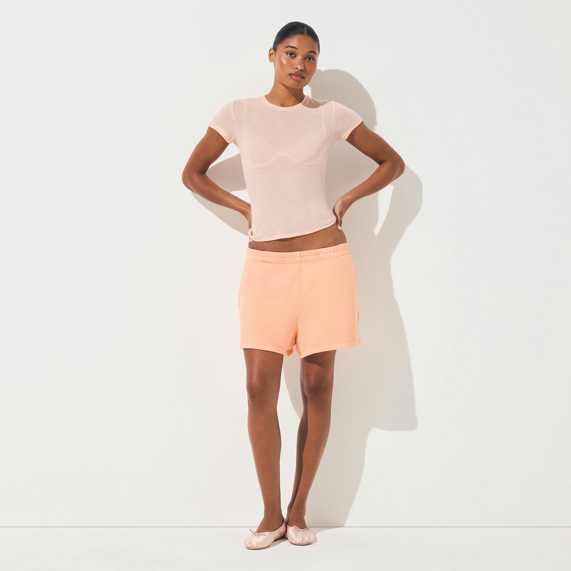 FRENCH TERRY CLASSIC SHORT | CANTALOUPE ON A MODEL FRONT VIEW | FOCUS: 0.0, 1.0, 0.9
