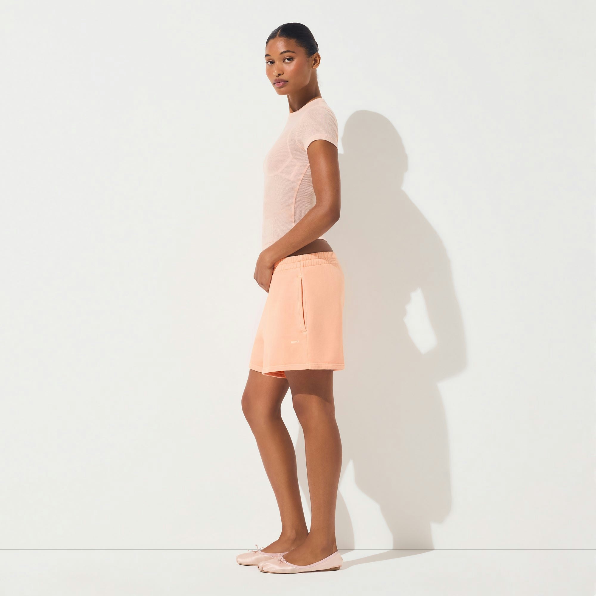 FRENCH TERRY CLASSIC SHORT | CANTALOUPE ON A MODEL FRONT VIEW | FOCUS: 0.0, 1.0, 0.9