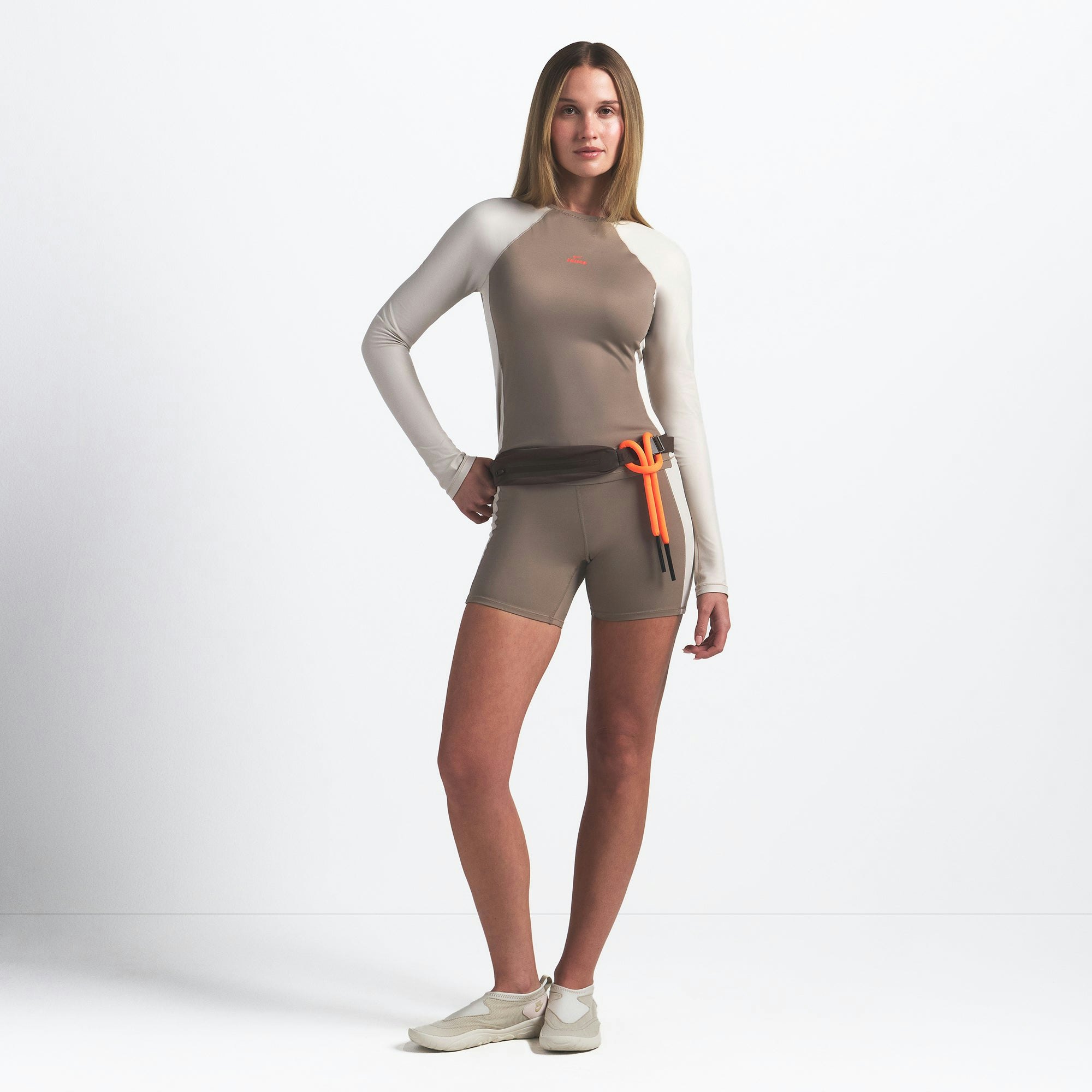 NikeSKIMS SHINE 5" BIKER SHORT | TRUFFLE AND STONE ON A MODEL FRONT VIEW @ | FOCUS: 0.0, 1.0, 0.9