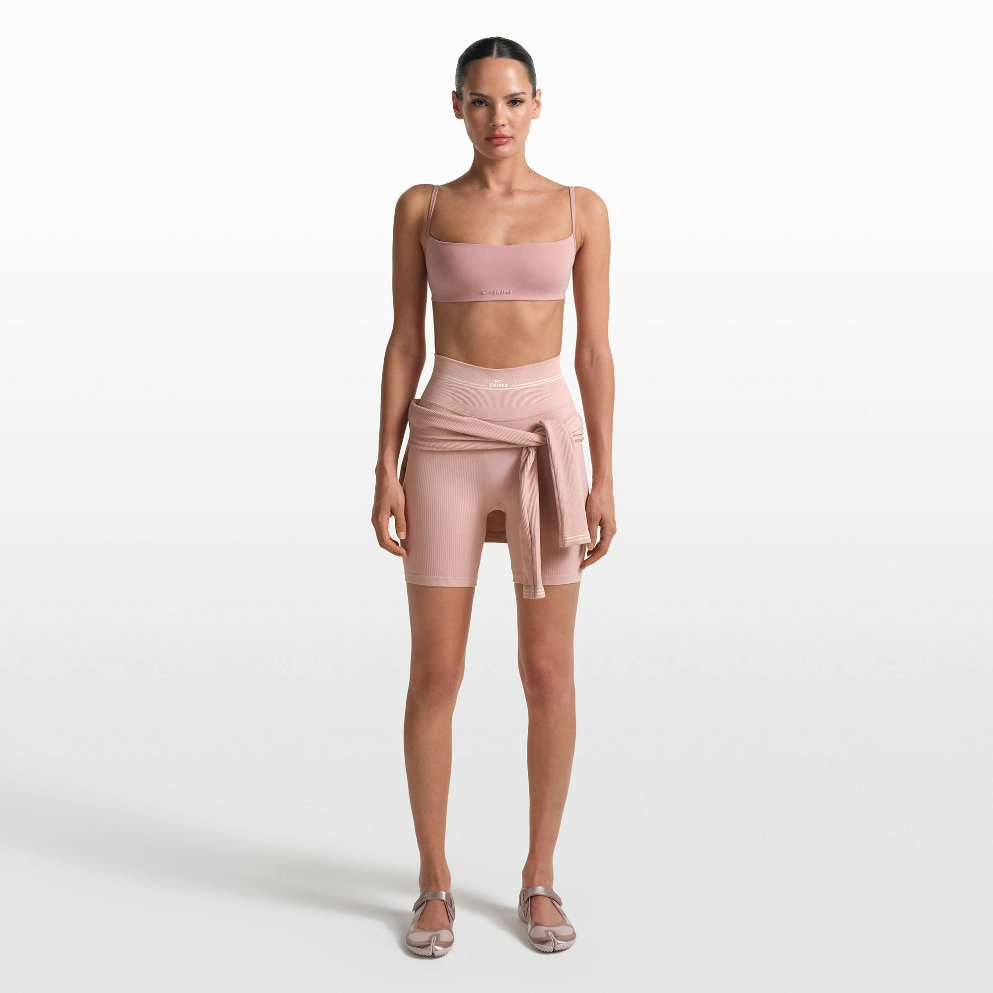 NikeSKIMS RIBBED SEAMLESS 5" BIKER SHORT | HIMALAYAN/ECRU ON A MODEL FRONT VIEW @ | FOCUS: 0.0, 1.0, 0.9