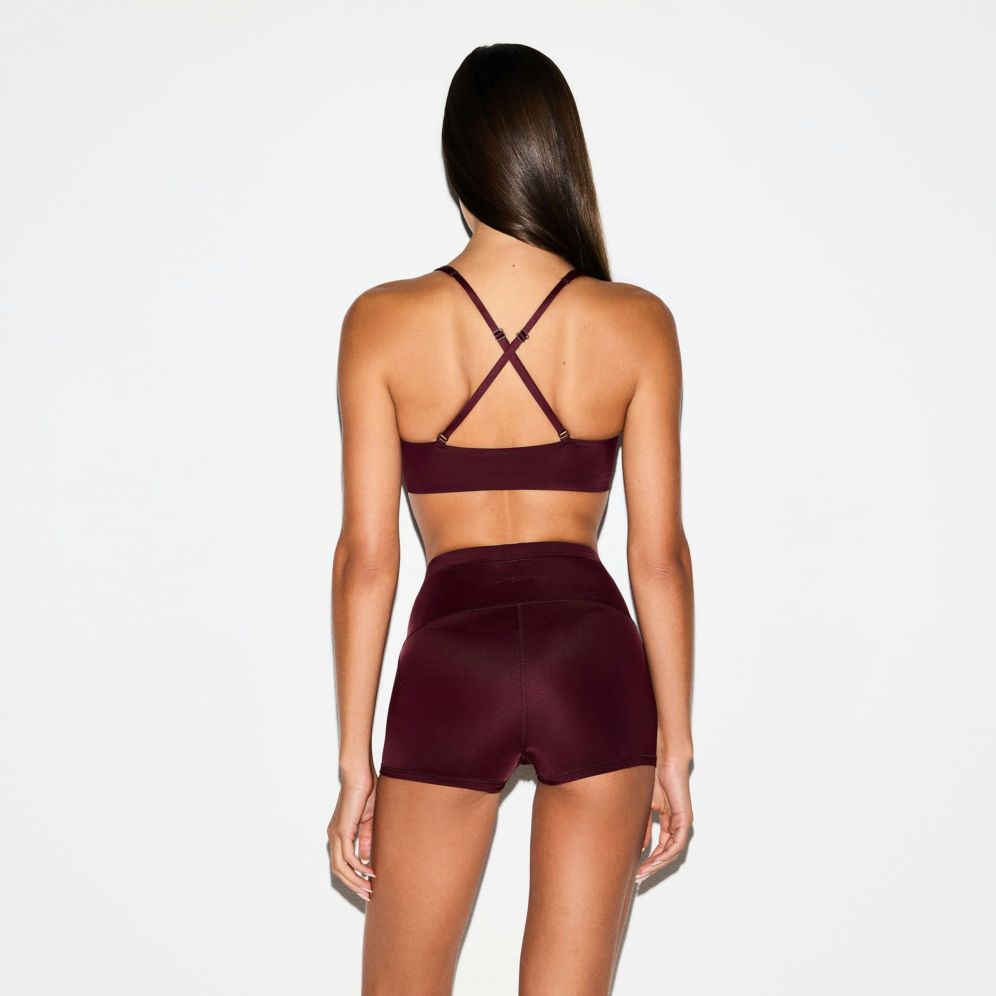 NikeSKIMS SHINE DRAWCORD 2" SHORT | CURRANT ON A MODEL SIDE VIEW @ | FOCUS: 0.0, 1.0, 0.9