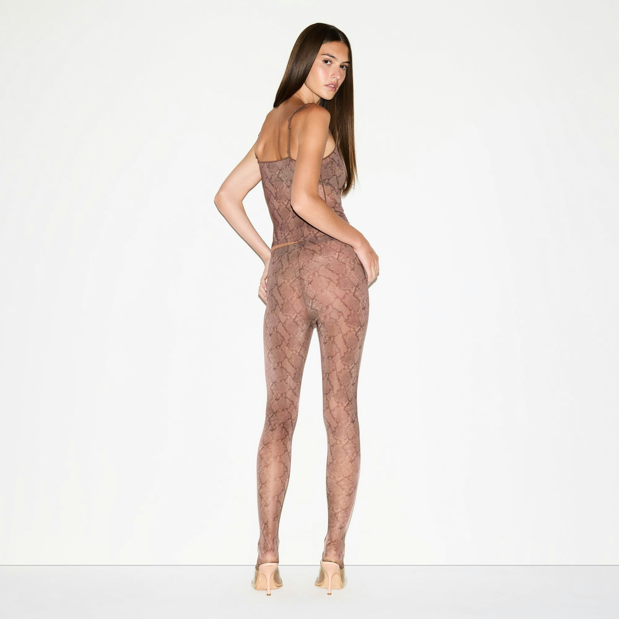 MILKY SHEER FOOTED LEGGING | JASPER SNAKE PRINT ON A MODEL FRONT VIEW @ | FOCUS: 0.0, 1.0, 0.9