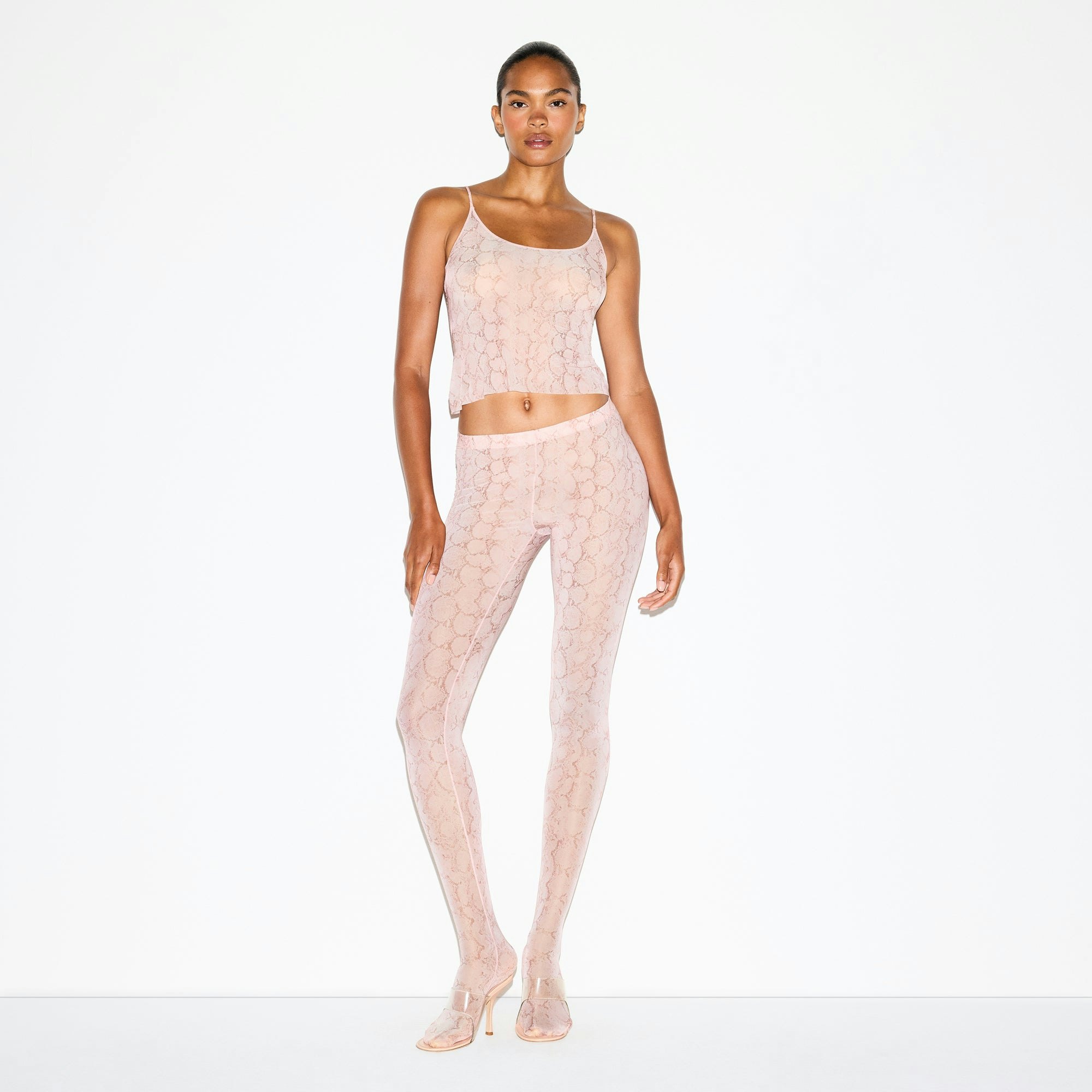 MILKY SHEER FOOTED LEGGING | ROSE PASTEL SNAKE PRINT ON A MODEL FRONT VIEW @ | FOCUS: 0.0, 1.0, 0.9