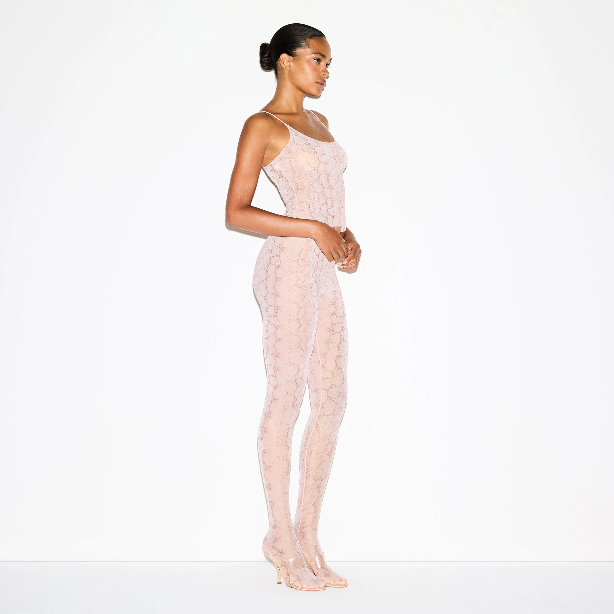 MILKY SHEER FOOTED LEGGING | ROSE PASTEL SNAKE PRINT ON A MODEL FRONT VIEW @ | FOCUS: 0.0, 1.0, 0.9