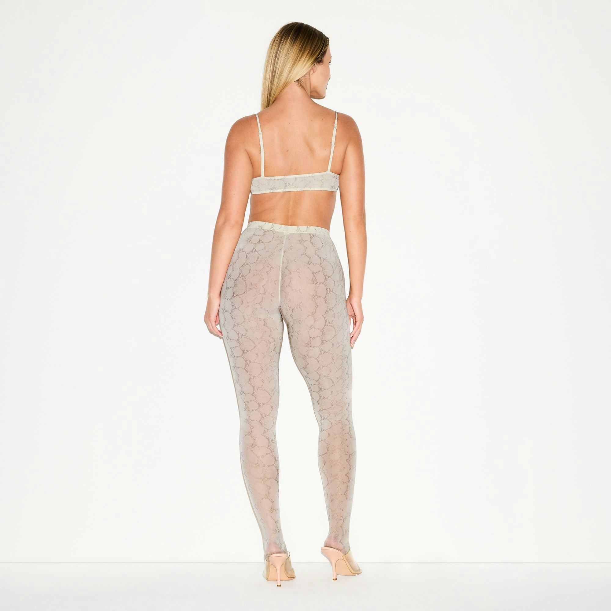 MILKY SHEER FOOTED LEGGING | STONE PASTEL SNAKE PRINT ON A MODEL FRONT VIEW @ | FOCUS: 0.0, 1.0, 0.9