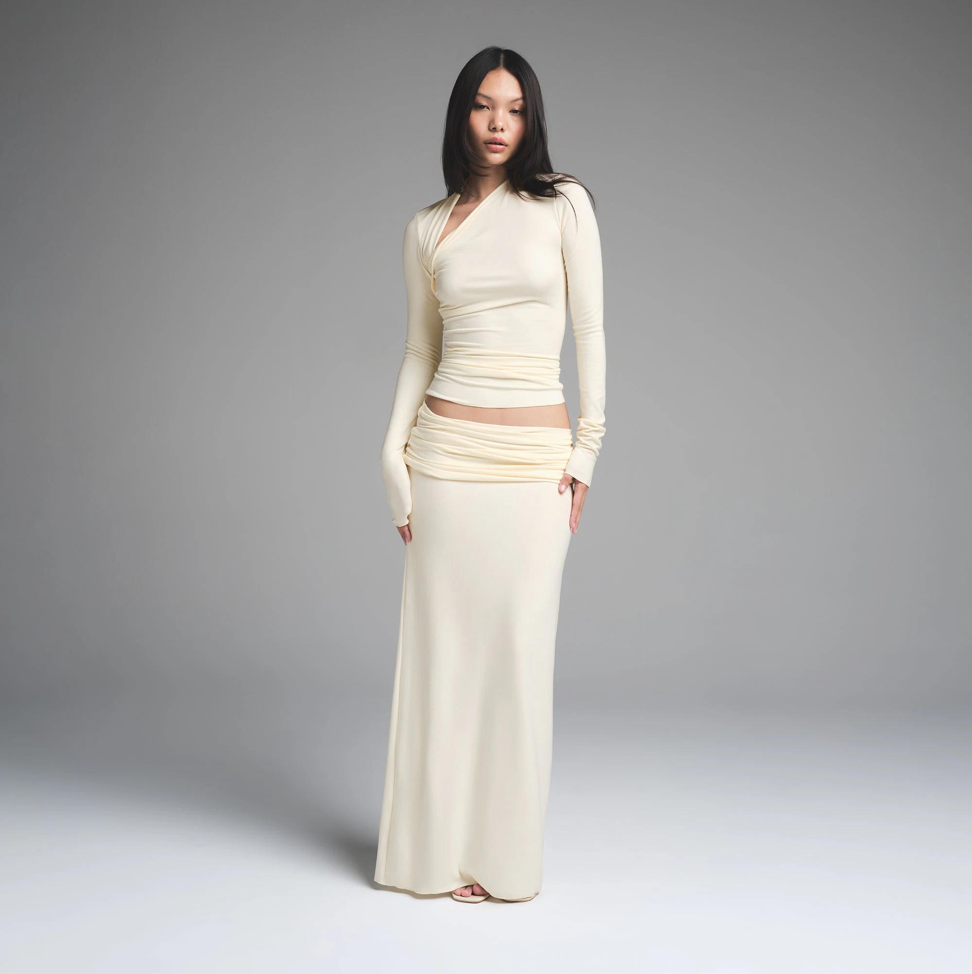 SKIMS CLOUD FOLDOVER SKIRT | ECRU ON A MODEL FRONT VIEW | FOCUS: 0.0, 1.0, 0.9