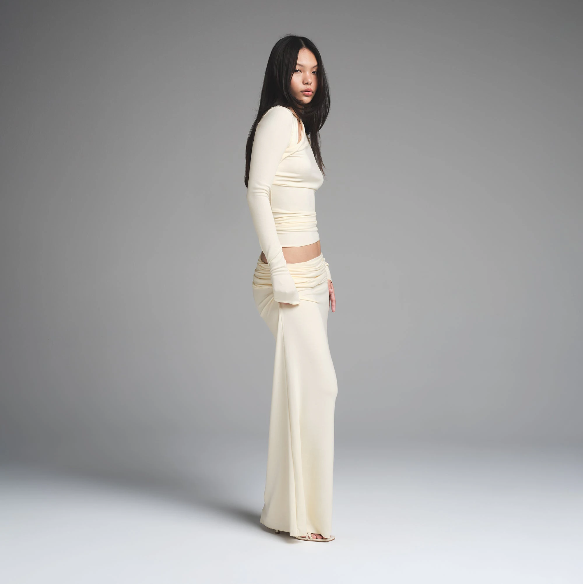 SKIMS CLOUD FOLDOVER SKIRT | ECRU ON A MODEL SIDE VIEW | FOCUS: 0.0, 1.0, 0.9