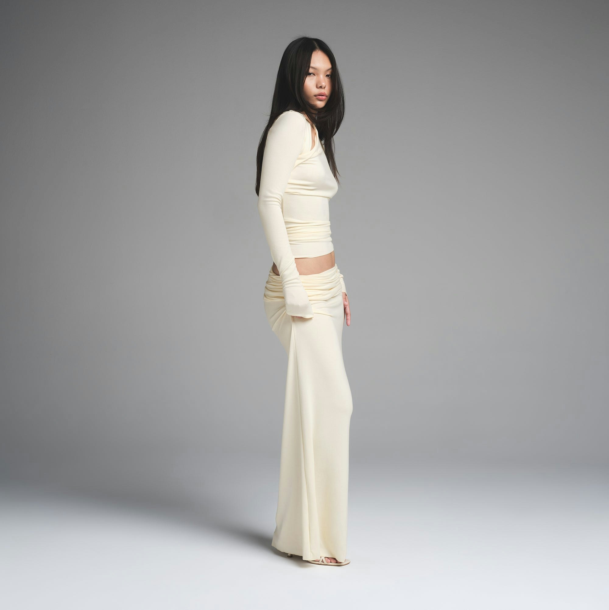 SKIMS CLOUD FOLDOVER SKIRT | ECRU ON A MODEL SIDE VIEW | FOCUS: 0.0, 1.0, 0.9