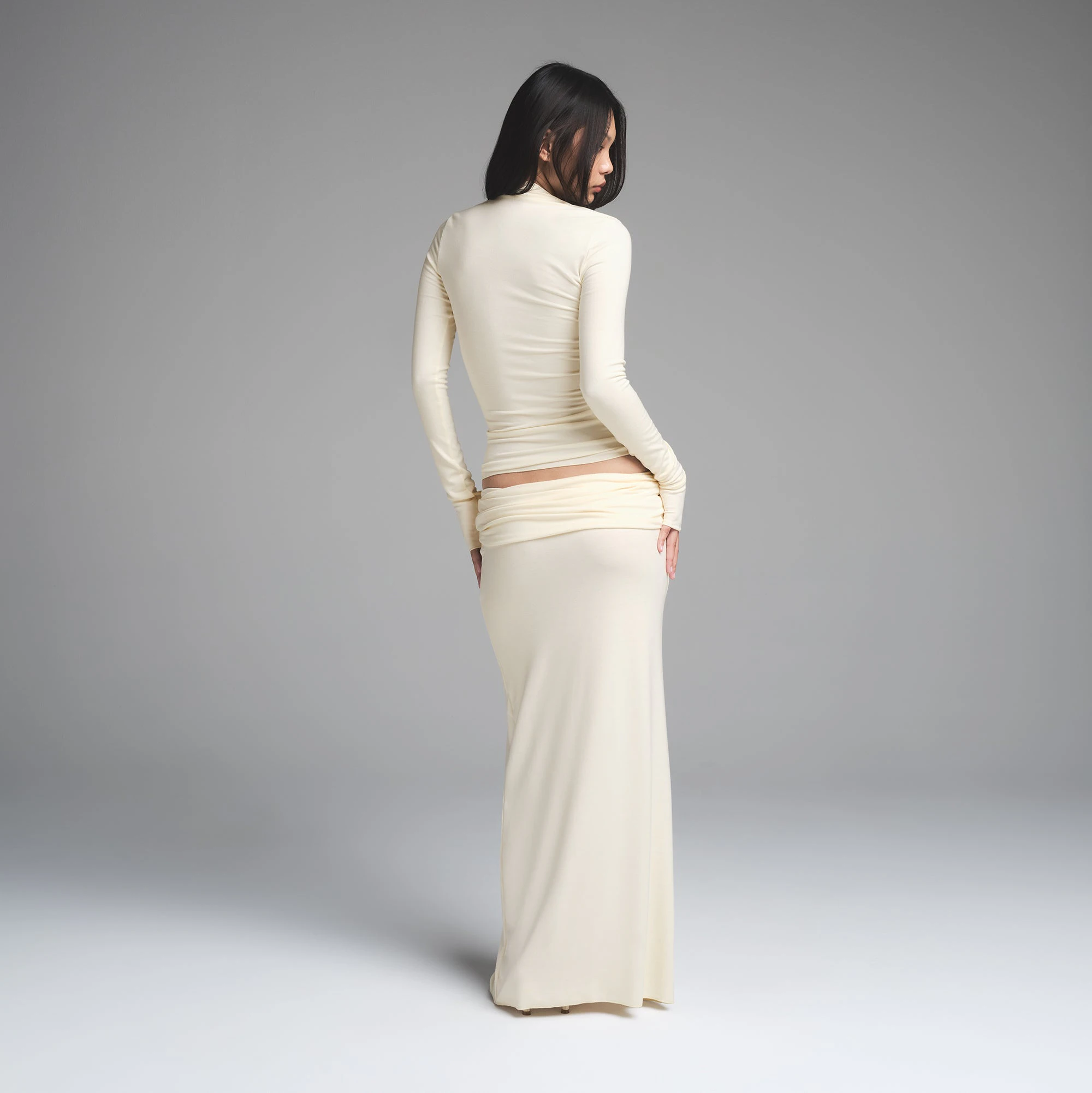 SKIMS CLOUD FOLDOVER SKIRT | ECRU ON A MODEL BACK VIEW | FOCUS: 0.0, 1.0, 0.9