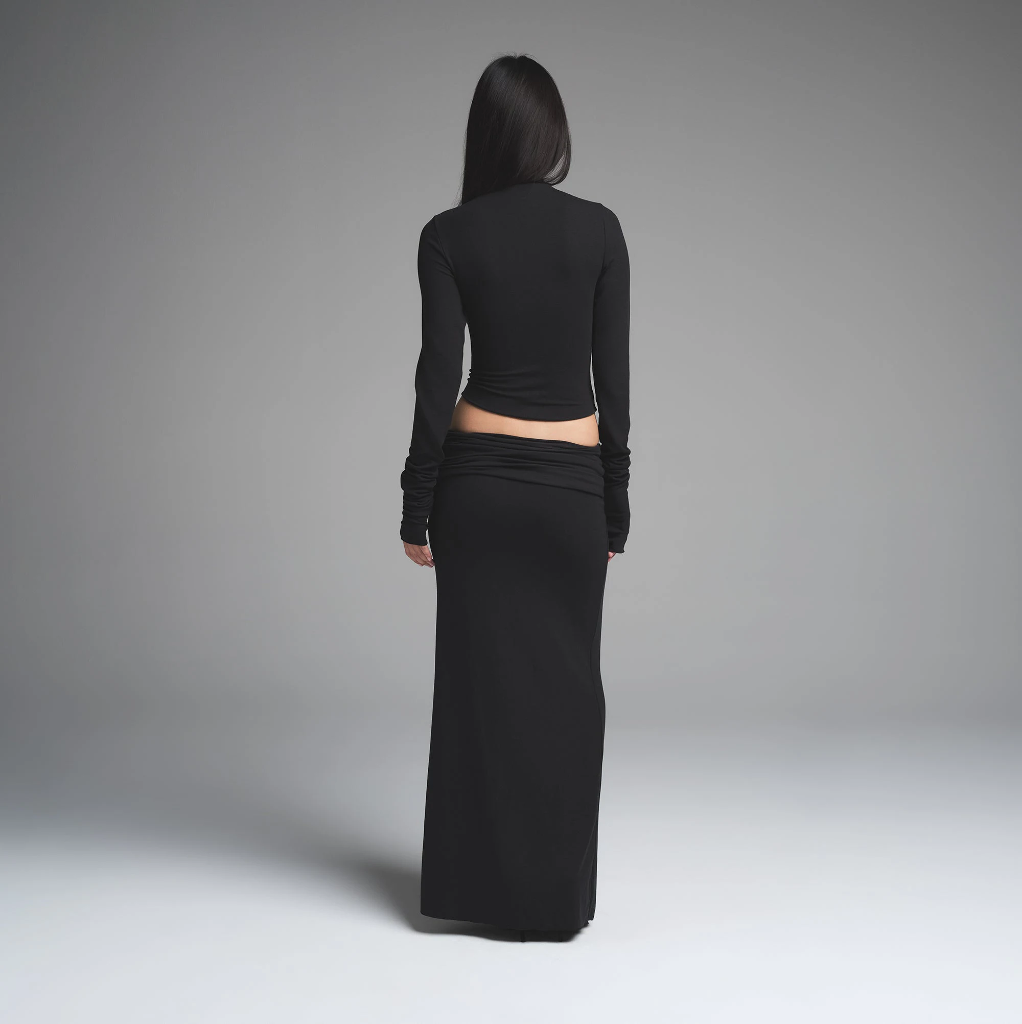 SKIMS CLOUD FOLDOVER SKIRT | ONYX ON A MODEL BACK VIEW | FOCUS: 0.0, 1.0, 0.9