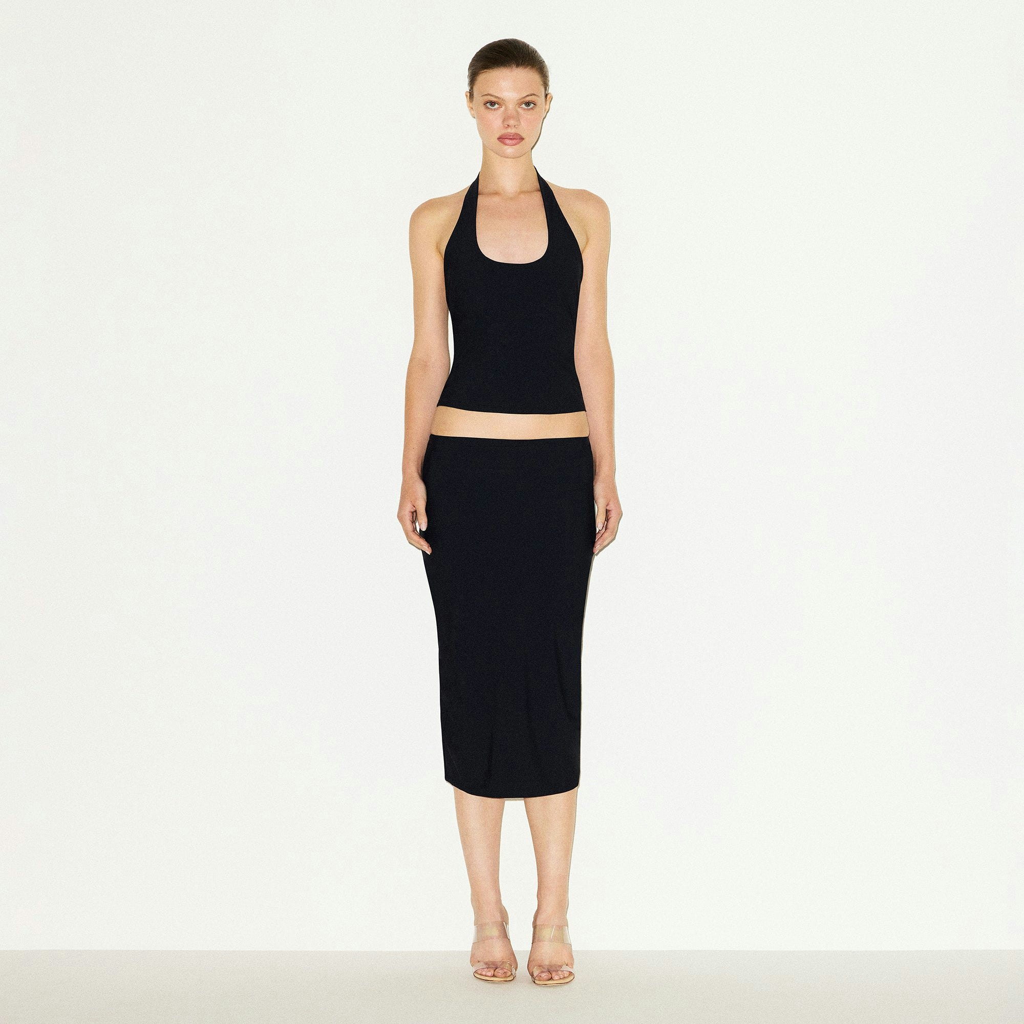 CLING MATTE MIDI SKIRT | OBSIDIAN ON A MODEL FRONT VIEW @ | FOCUS: 0.0, 1.0, 0.9