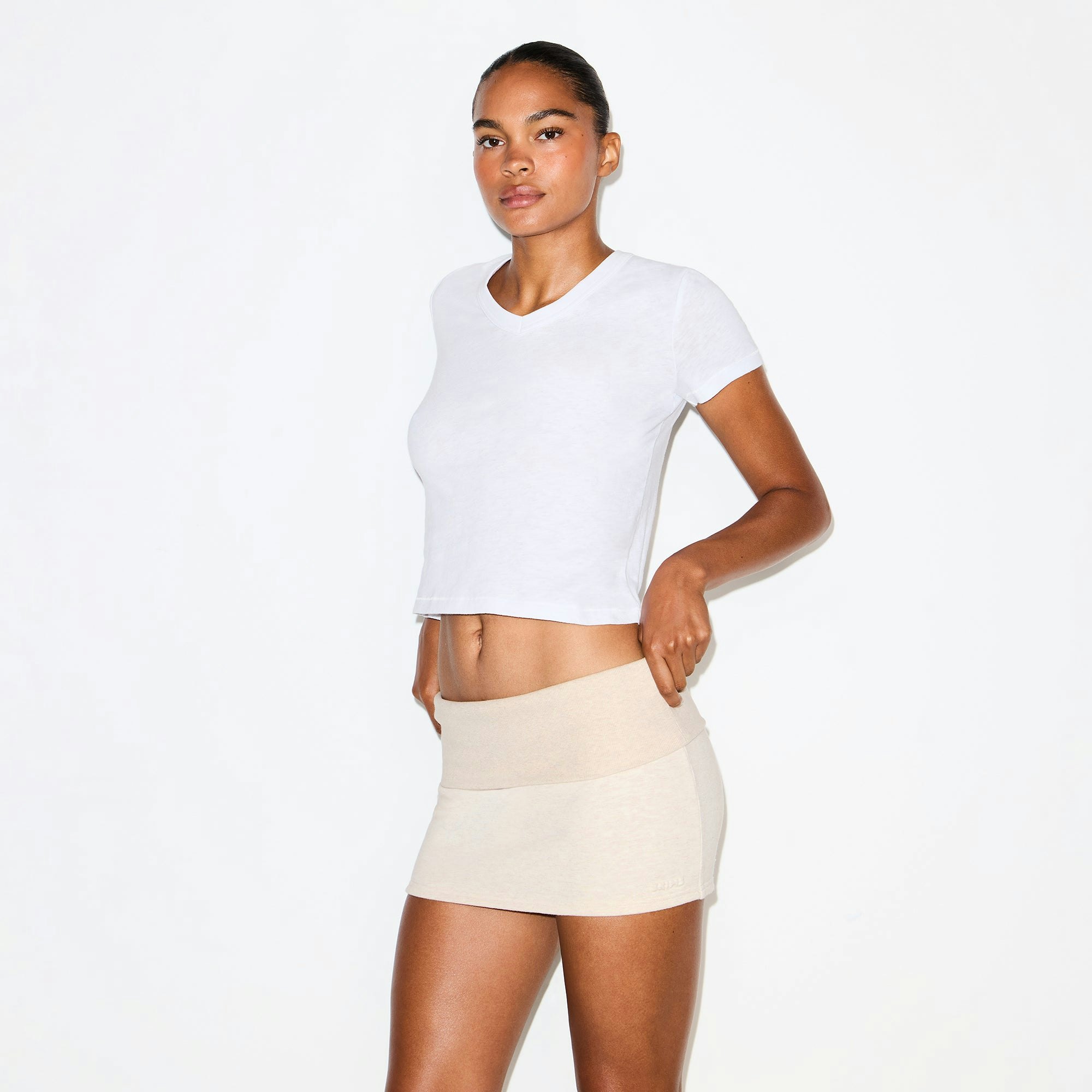 COTTON FLEECE FOLDOVER MINI SKIRT | OATMEAL HEATHER ON A MODEL SIDE VIEW @ | FOCUS: 0.0, 1.0, 0.9