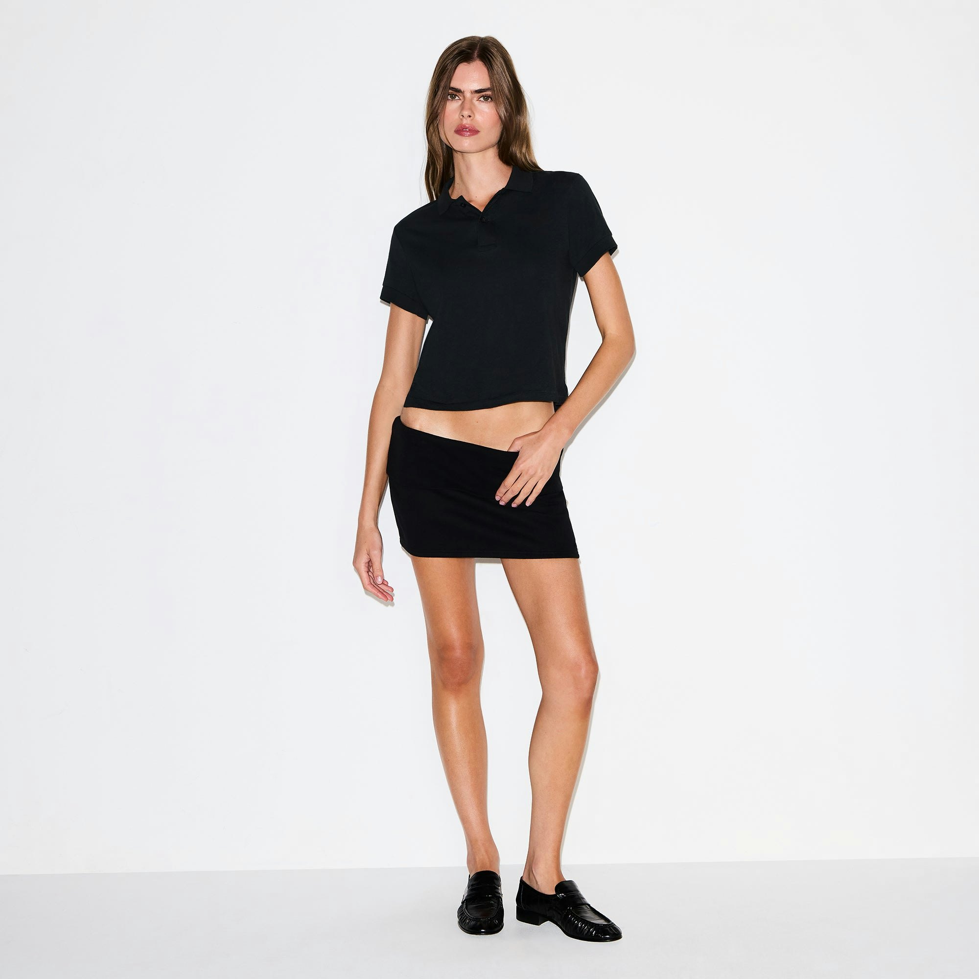 COTTON FLEECE FOLDOVER MINI SKIRT | ONYX ON A MODEL FRONT VIEW @ | FOCUS: 0.0, 1.0, 0.9