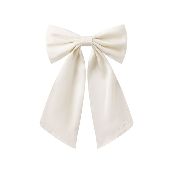 SATIN JUMBO BOW CLIP | IVORY LAYS FLAT ON A WHITE BACKGROUND @ | FOCUS: 0.0, 1.0, 0.9