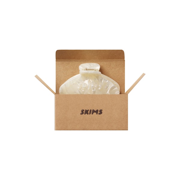 GETTING READY ACCESSORIES EMBOSSED LOGO MINI CLAW CLIP | IVORY PEARL LAYS FLAT ON A WHITE BACKGROUND | FLT 