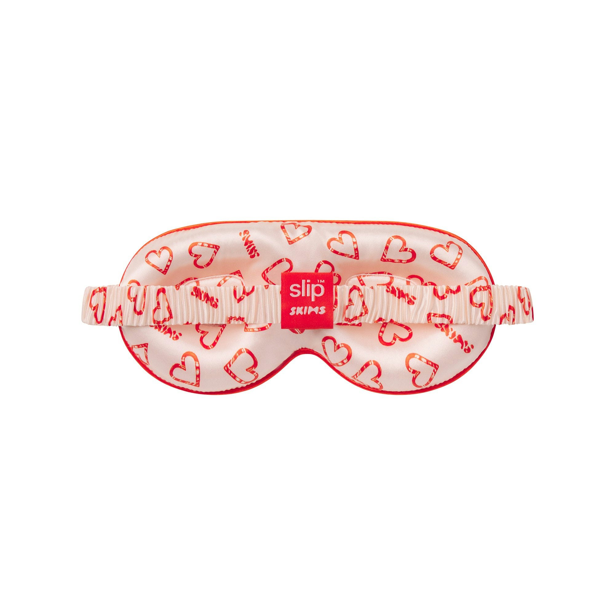SLIP X SKIMS PURE SILK CONTOUR SLEEP MASK | CHERRY BLOSSOM CANDY HEART PRINT FLAT ON A WHITE BACKGROUND | FLT