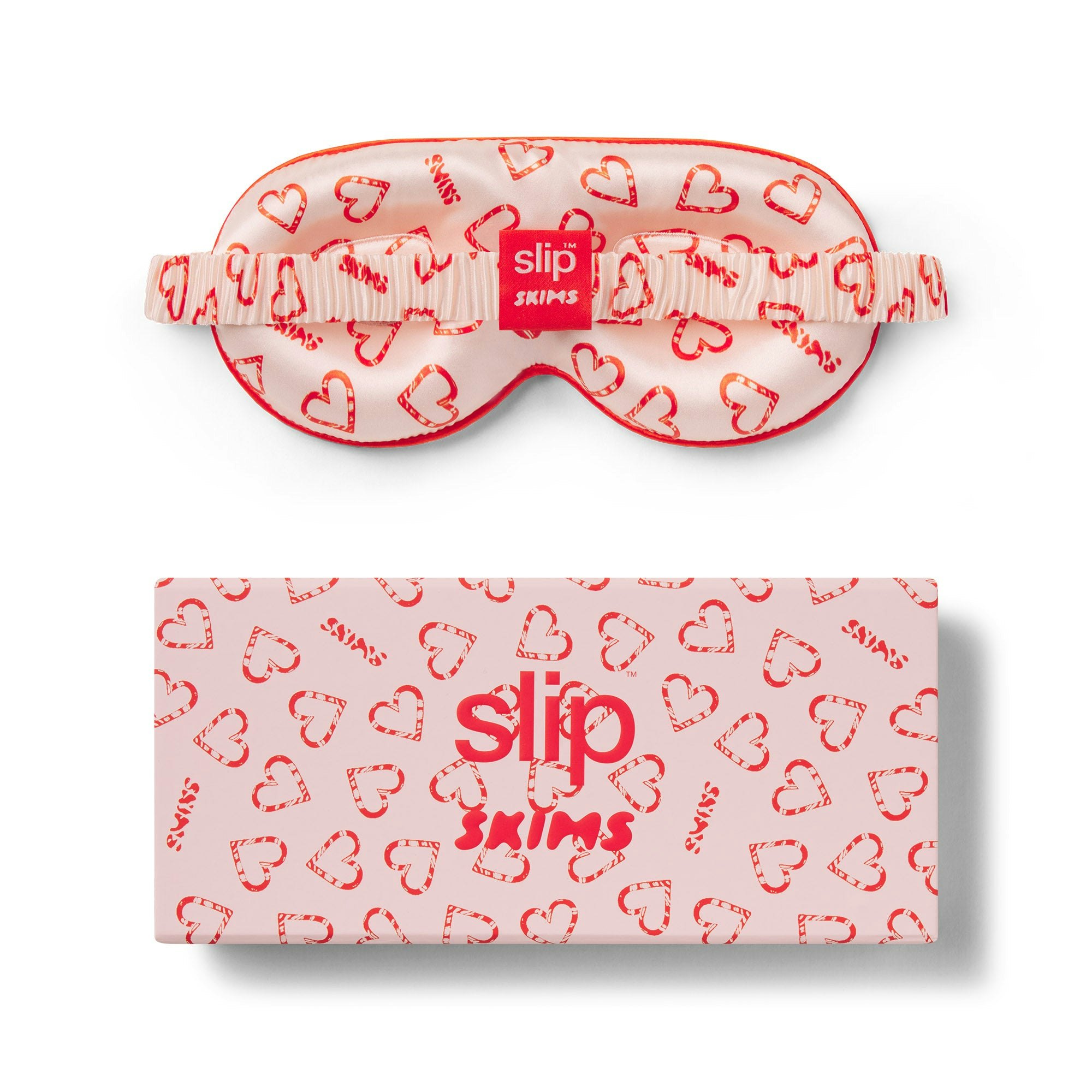 SLIP X SKIMS PURE SILK CONTOUR SLEEP MASK | CHERRY BLOSSOM CANDY HEART PRINT FLAT ON A WHITE BACKGROUND | FLT