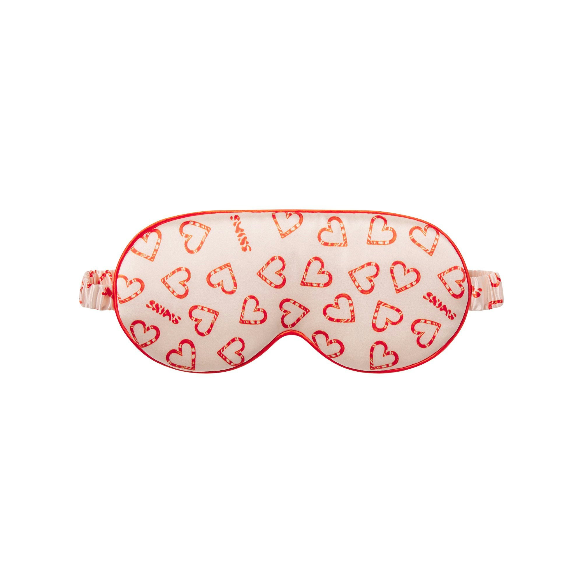 SLIP X SKIMS PURE SILK CONTOUR SLEEP MASK | CHERRY BLOSSOM CANDY HEART PRINT FLAT ON A WHITE BACKGROUND | FLT