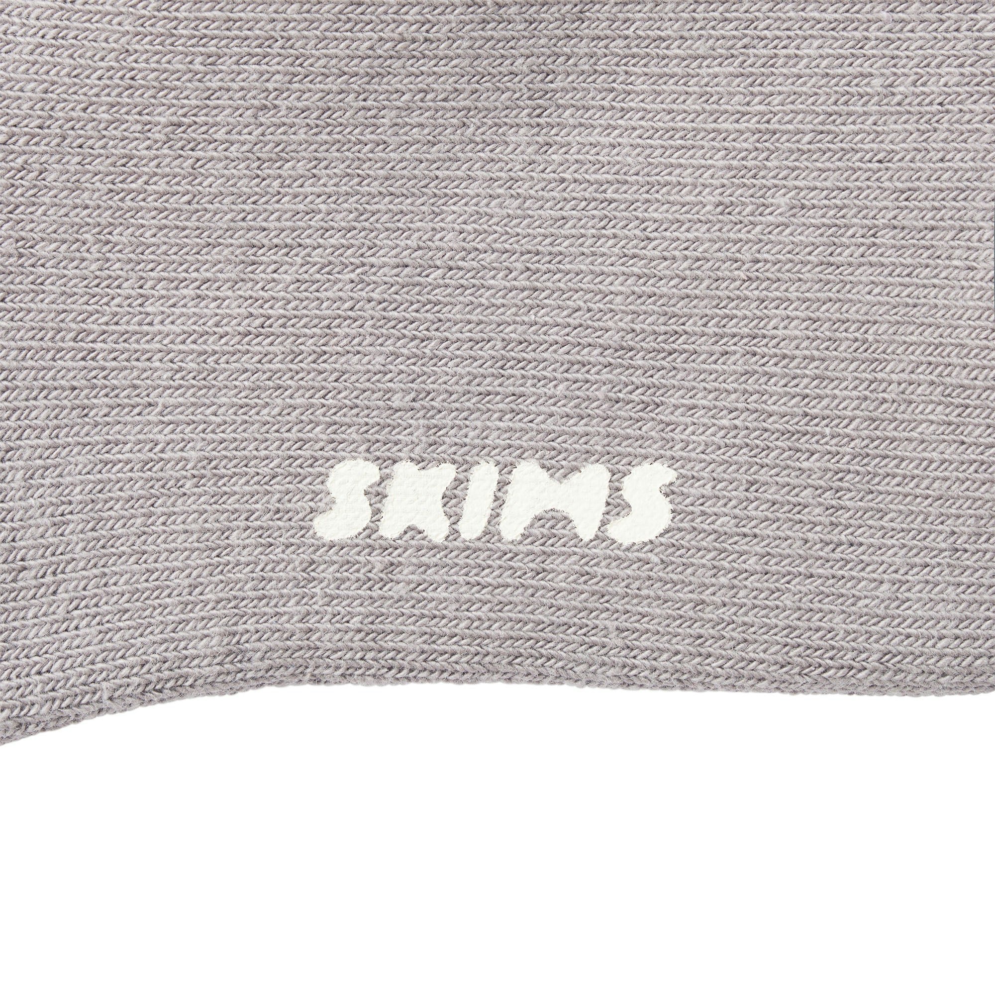 MENS LOUNGE SOCK LAYS FLAT ON A WHITE BACKGROUND