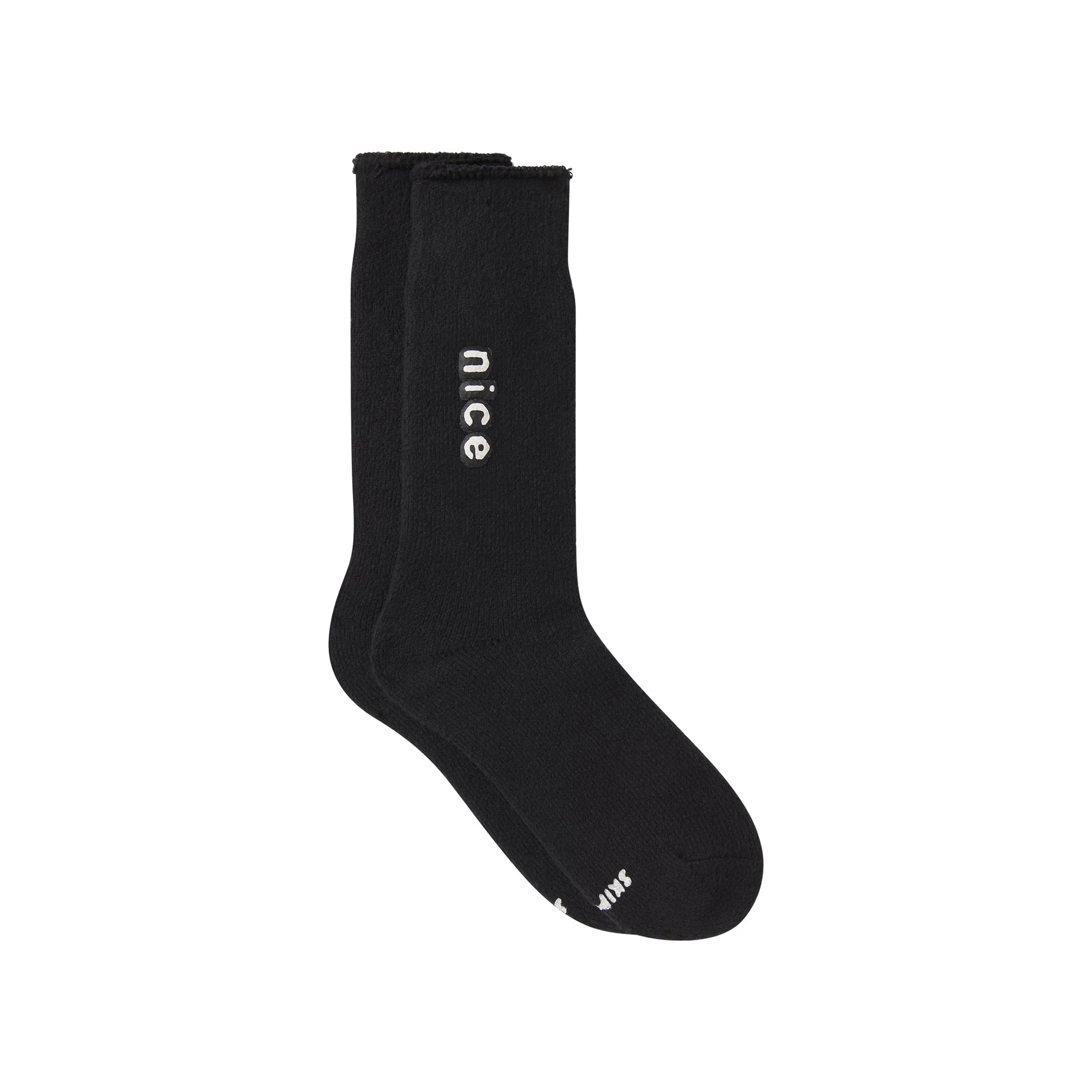 CACTUS PLANT FLEA MARKET X SKIMS PLUSH SOCK | ONYX FLAT ON A WHITE BACKGROUND