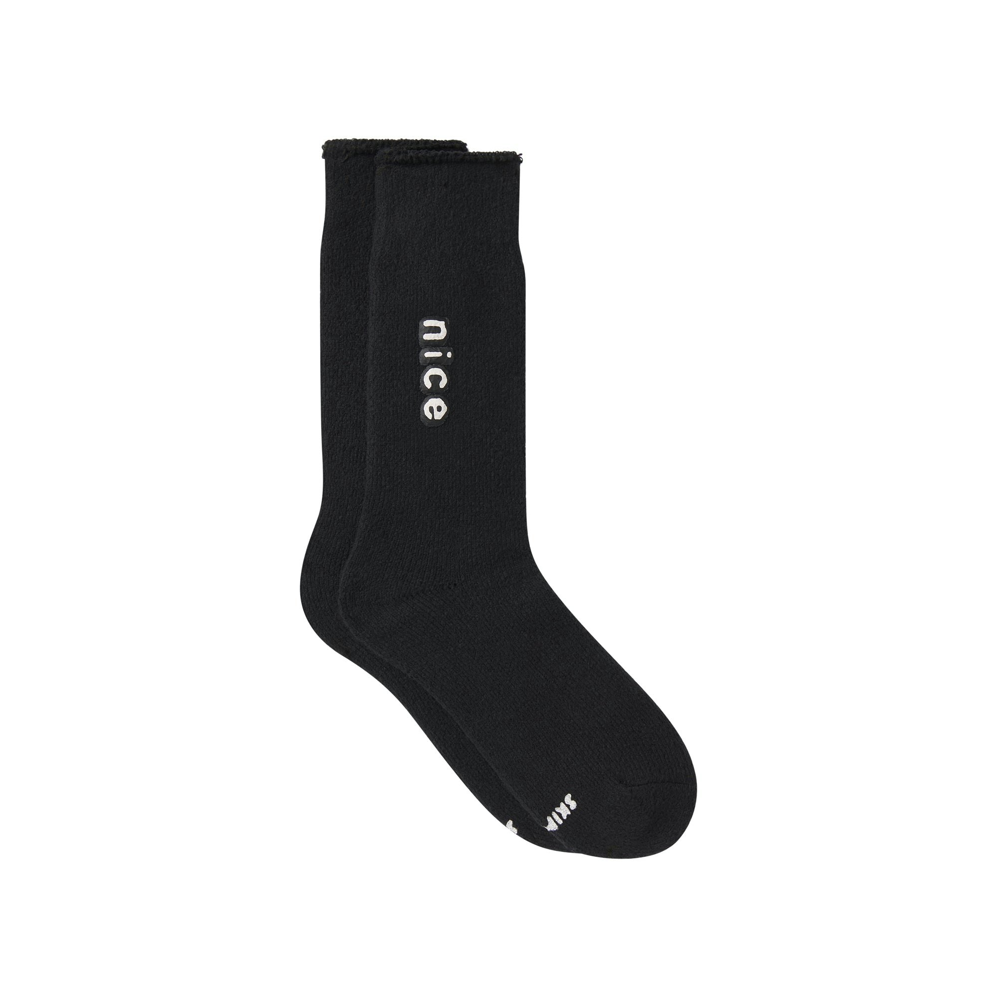 CACTUS PLANT FLEA MARKET X SKIMS PLUSH SOCK | ONYX FLAT ON A WHITE BACKGROUND