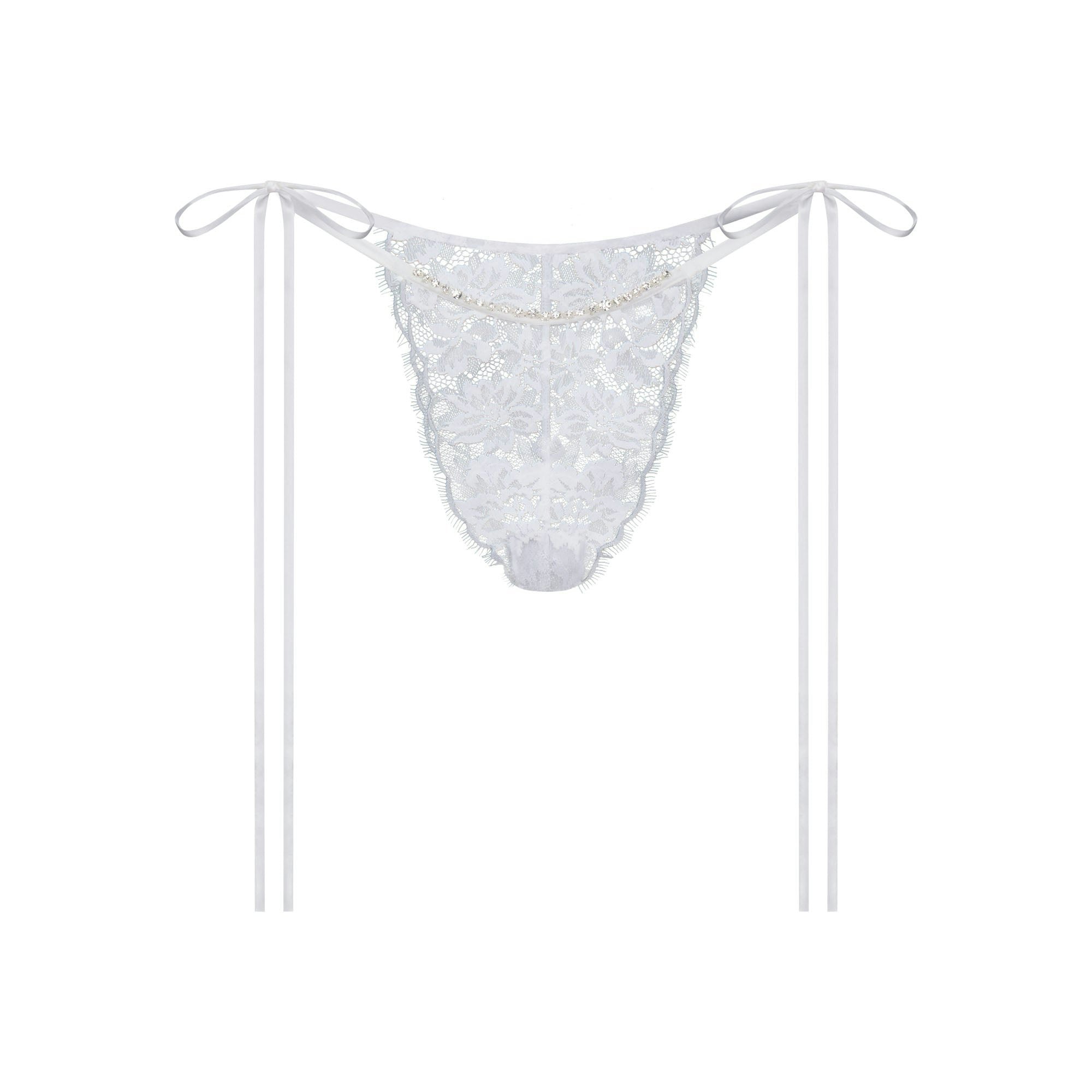 SKIMS LACE TIE SIDE TANGA | SNOW FLAT ON A WHITE BACKGROUND | FLT