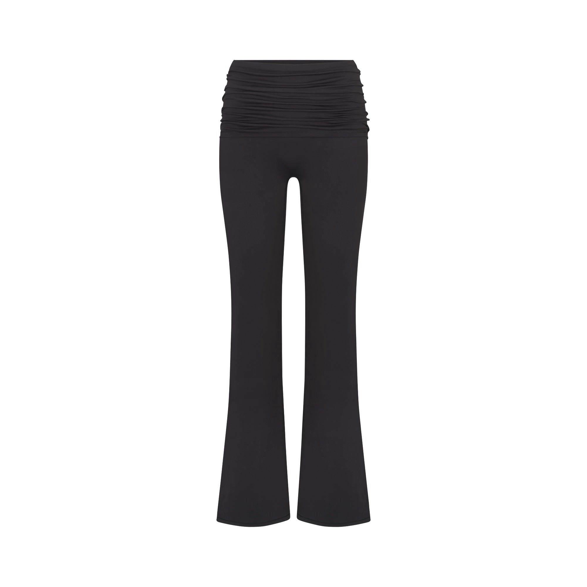 NikeSKIMS MATTE FOLDOVER SLIM FLARE LEGGING | OBSIDIAN FLAT ON A WHITE BACKGROUND | FLT