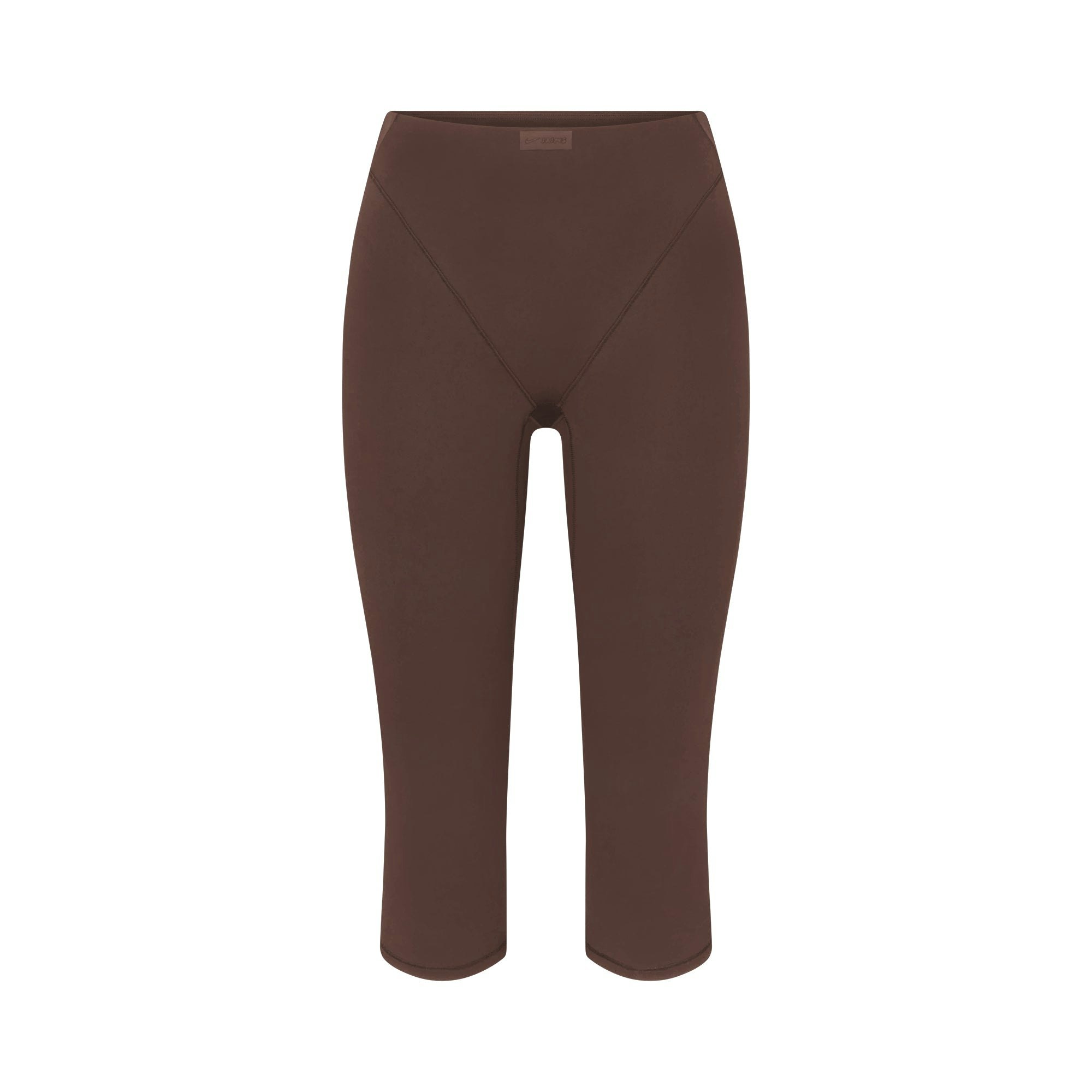 NikeSKIMS MATTE 17" V-LINE CROP LEGGING | DARK SEPIA FLAT ON A WHITE BACKGROUND | FLT