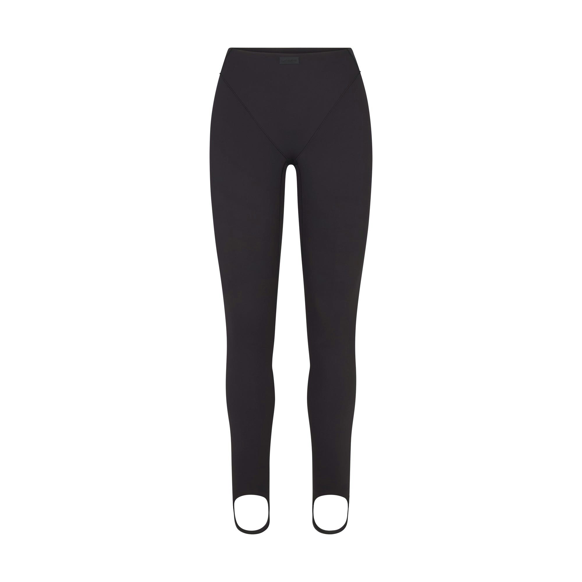 NikeSKIMS MATTE V-LINE STIRRUP LEGGING | OBSIDIAN FLAT ON A WHITE BACKGROUND | FLT