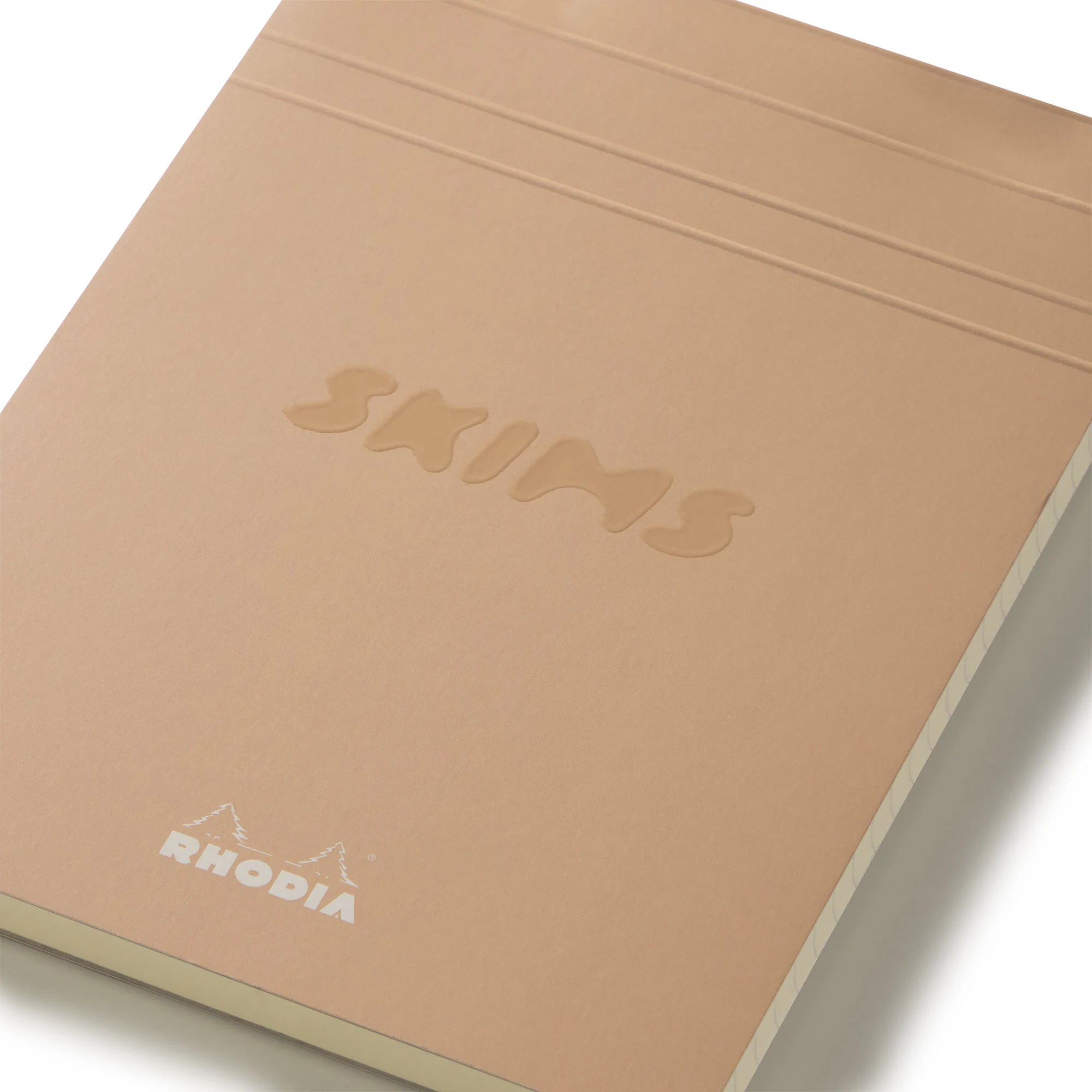 RHODIA X SKIMS NOTEPAD SET | NEUTRAL MULTI & LAYS FLAT ON A WHITE BACKGROUND | FLT
