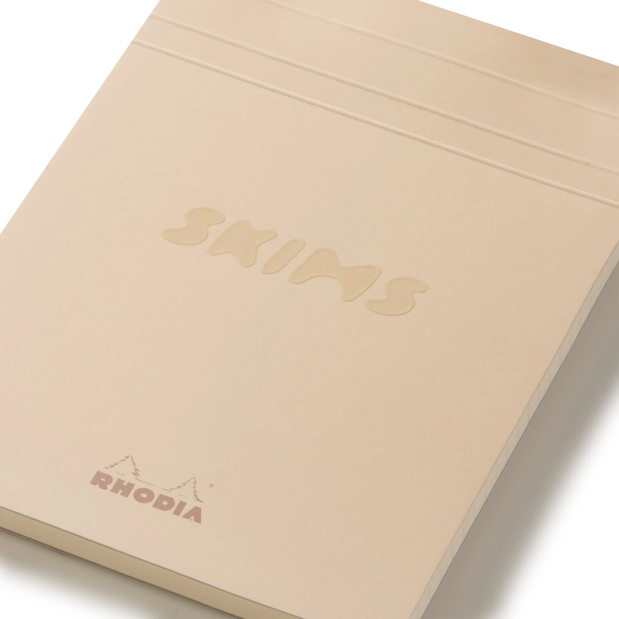 RHODIA X SKIMS NOTEPAD SET | NEUTRAL MULTI & LAYS FLAT ON A WHITE BACKGROUND | FLT