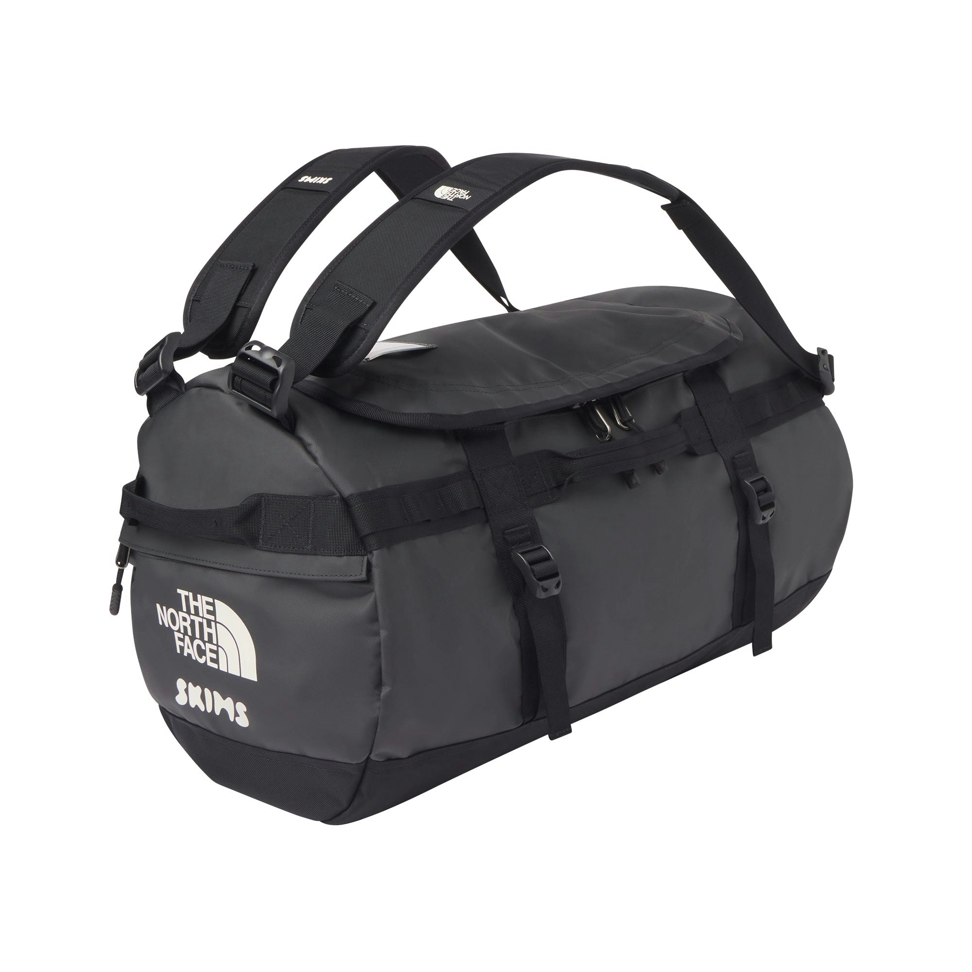 THE NORTH FACE X SKIMS SMALL BASE CAMP DUFFLE BAG | ONYX FLAT ON A WHITE BACKGROUND | FLT