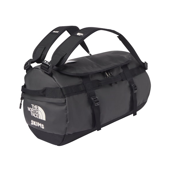 THE NORTH FACE X SKIMS SMALL BASE CAMP DUFFLE BAG | ONYX FLAT ON A WHITE BACKGROUND | FLT