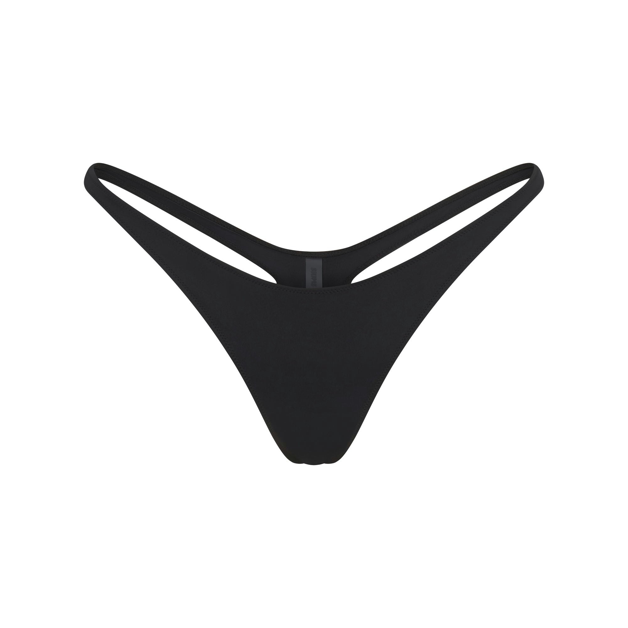 SIGNATURE SWIM THONG BIKINI BOTTOM | ONYX FLAT ON A WHITE BACKGROUND | FLT