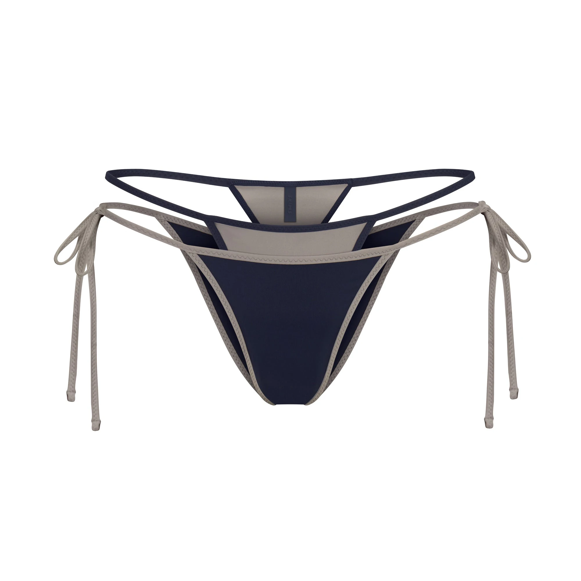 SIGNATURE SWIM LAYERED TIE SIDE BIKINI BOTTOM | NAVY CONTRAST LAYS FLAT ON A WHITE BACKGROUND | FLT