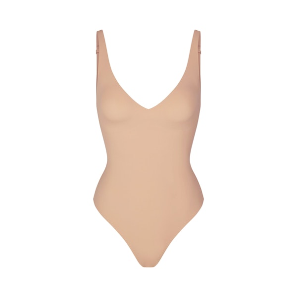 NAKED PLUNGE THONG BODYSUIT | CLAY (BODYSUITS) LAYS FLAT ON A WHITE BACKGROUND | FLT