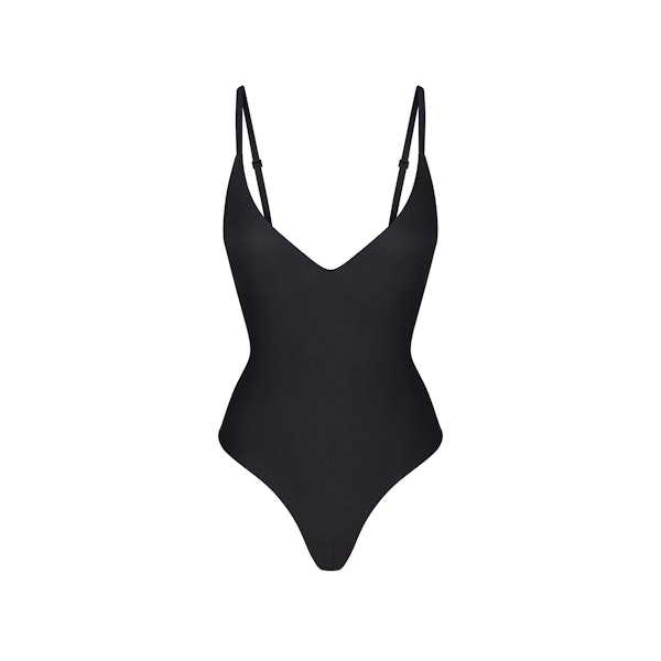 SKIMS BODY PUSH-UP THONG BODYSUIT | ONYX (SHAPEWEAR BODYSUITS, SHAPEWEAR) FLAT ON A WHITE BACKGROUND | FLT
