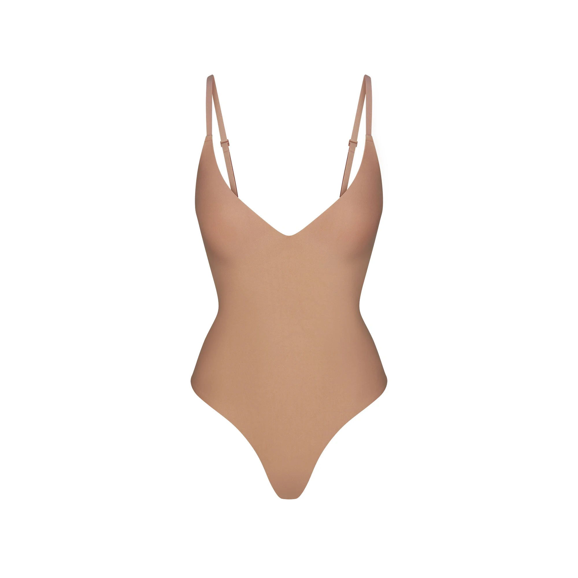SKIMS BODY PUSH-UP THONG BODYSUIT | SIENNA (SHAPEWEAR BODYSUITS, SHAPEWEAR) FLAT ON A WHITE BACKGROUND | FLT