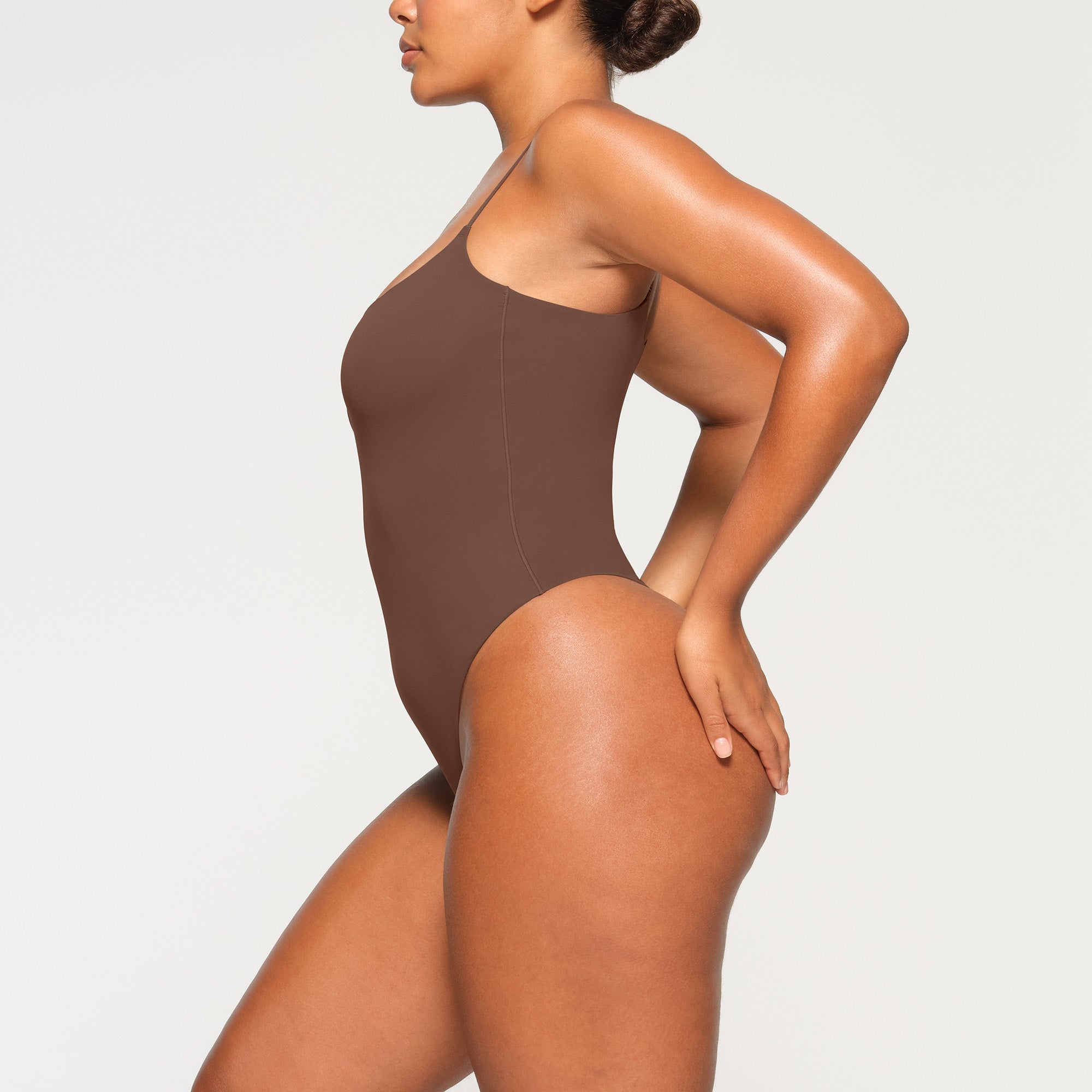 FITS EVERYBODY CAMI BODYSUIT WORN BY A MODEL IN SIDE VIEW